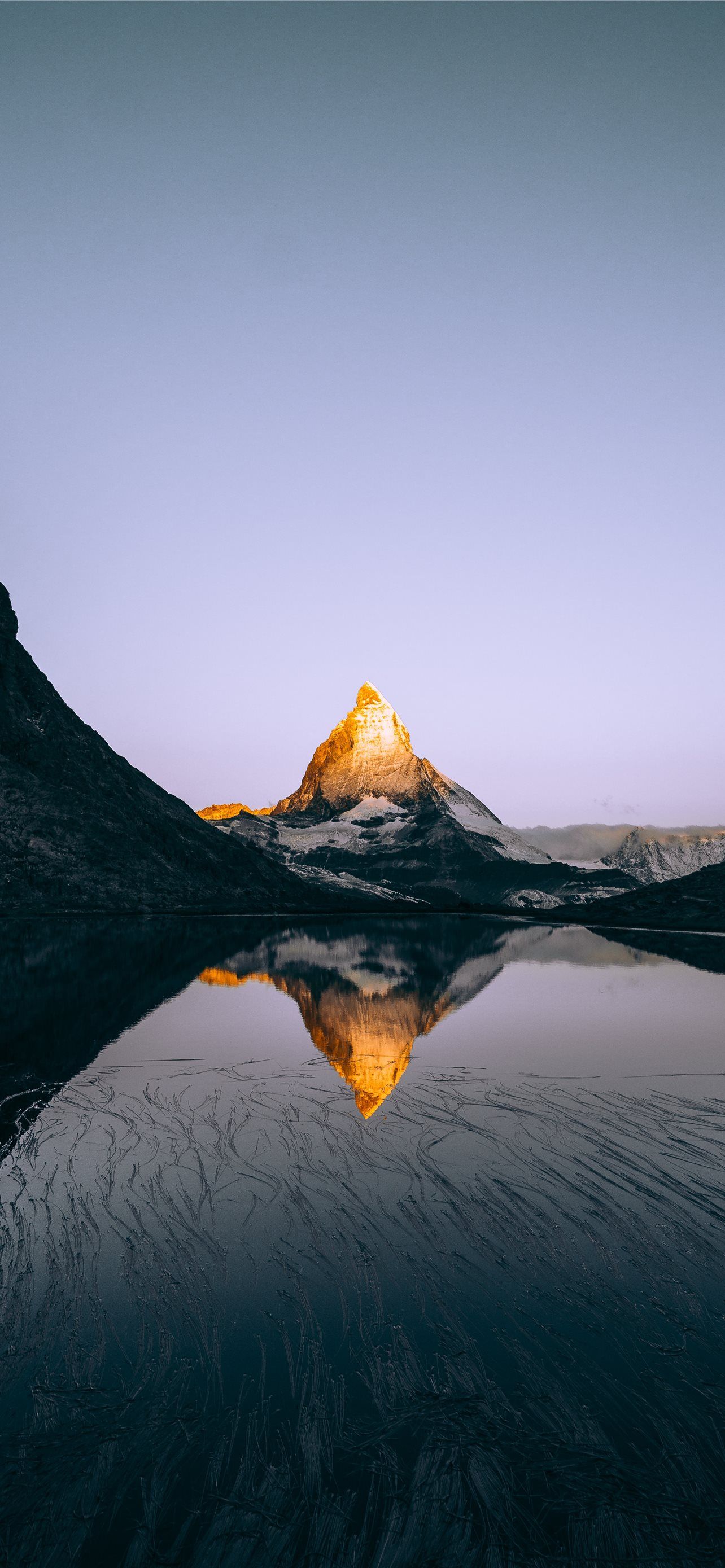 1284x2778 mountain and body of water under white clouds duri. iPhone Wallpaper Free Download