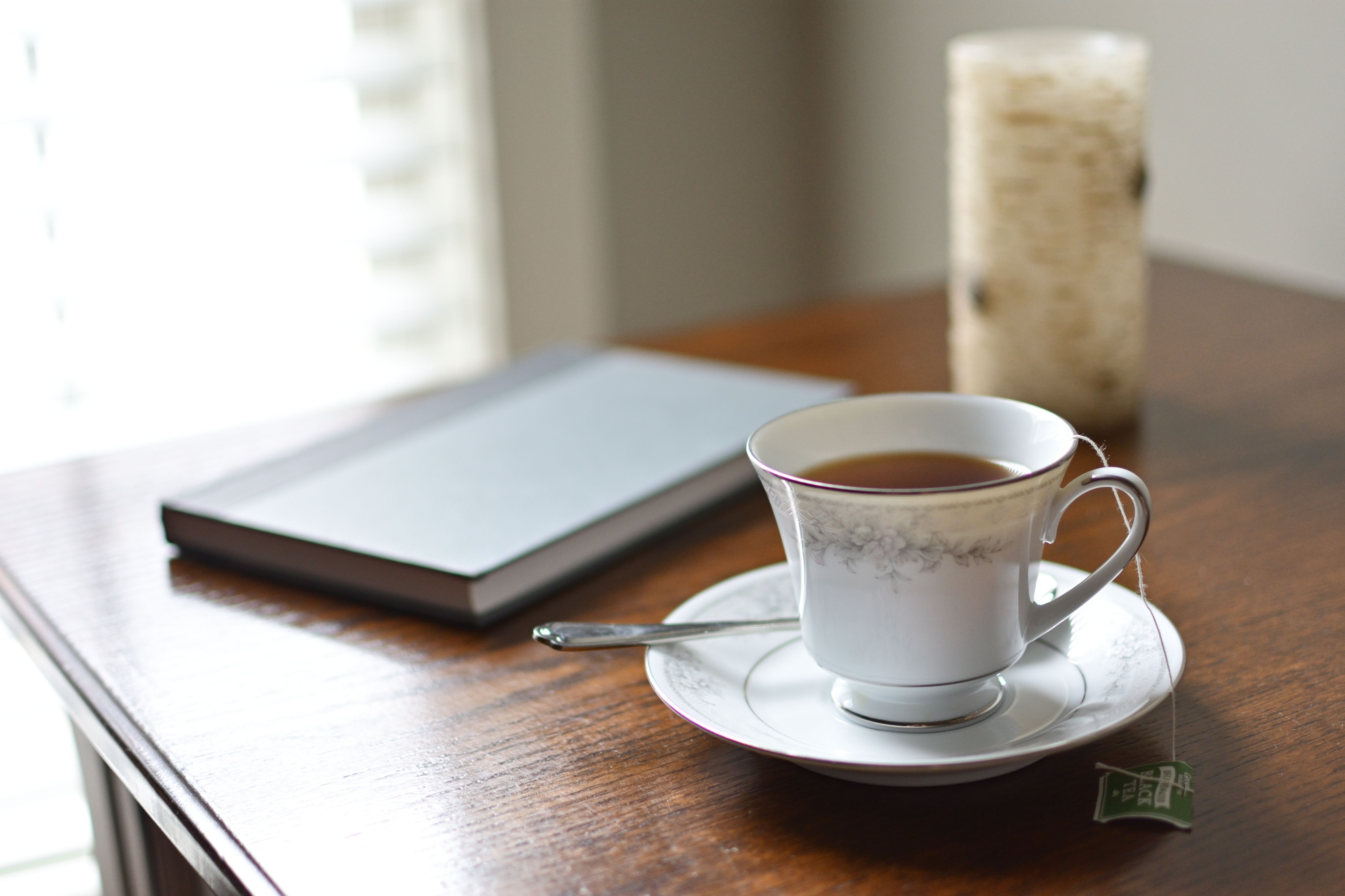 6000x4000 Cozy Morning Tea with Journal and Candle on Wooden Table · Free