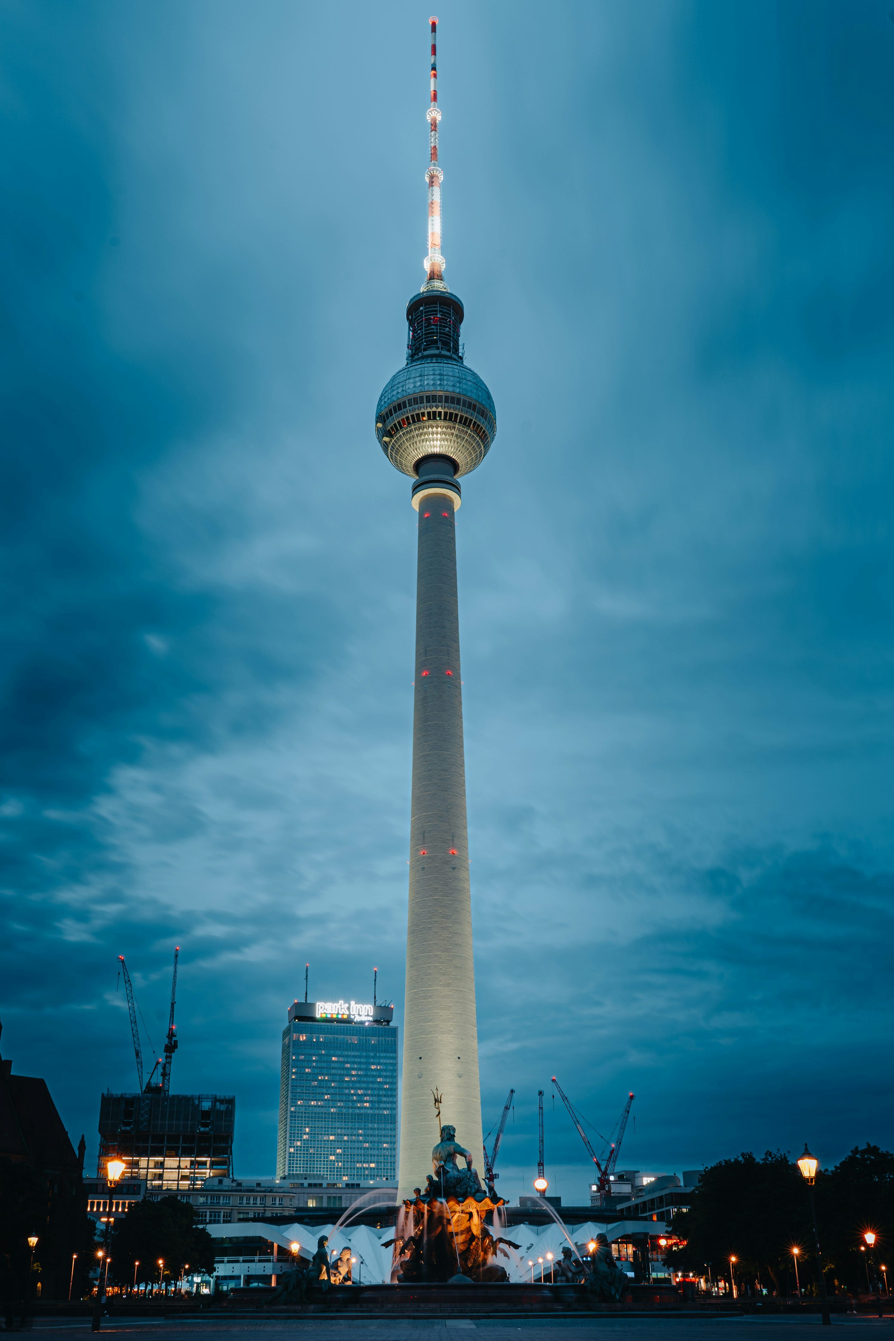 3000x4500 The berlin TV tower stands tall against a cloudy sky