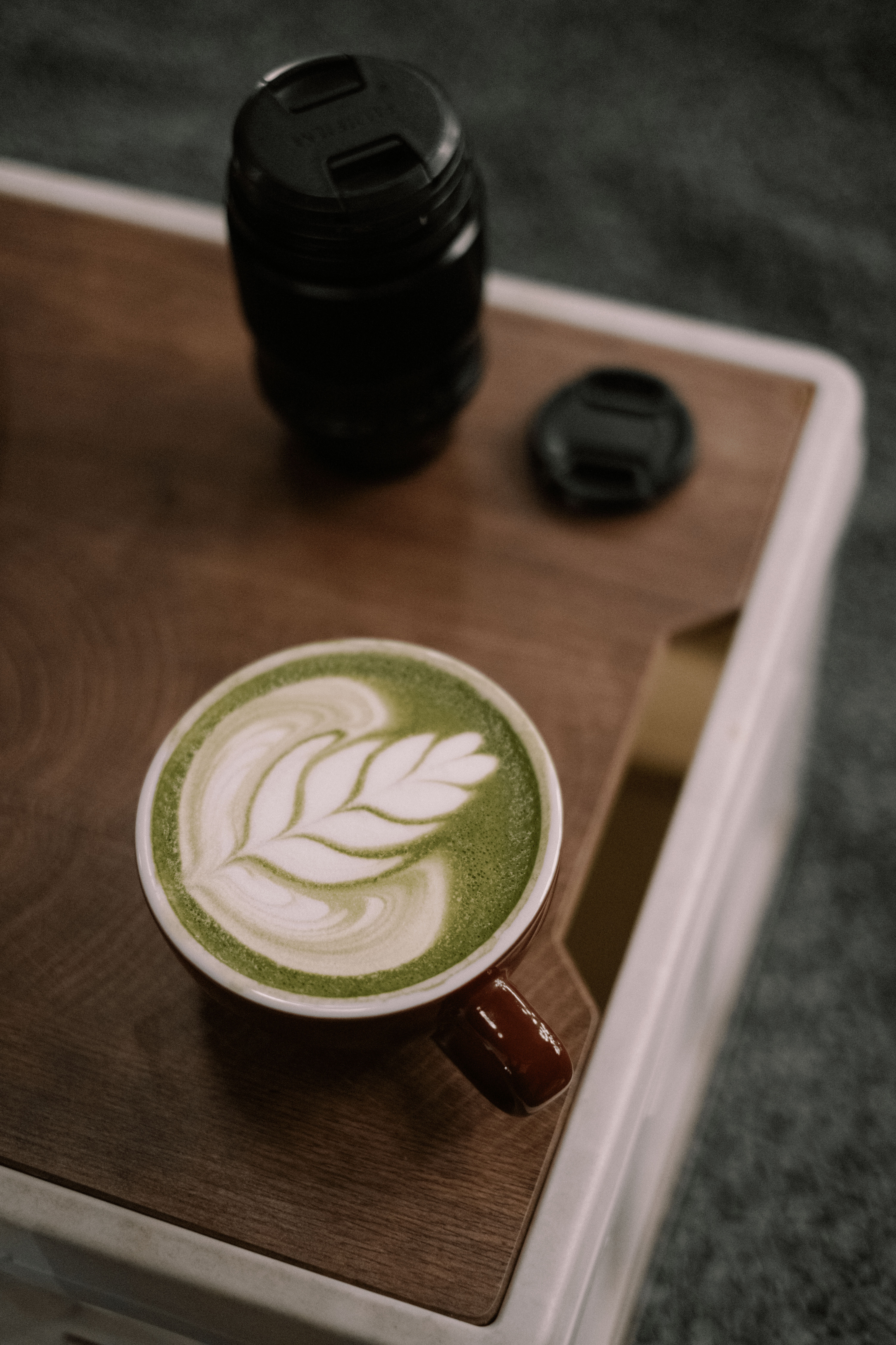 4160x6240 Decorated Matcha Latte and a Camera Zoom on a Wooden Desk · Free