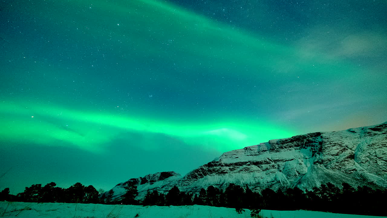 1280x720 Beautiful view of a night winter landscape with northern lights, aurora borealis