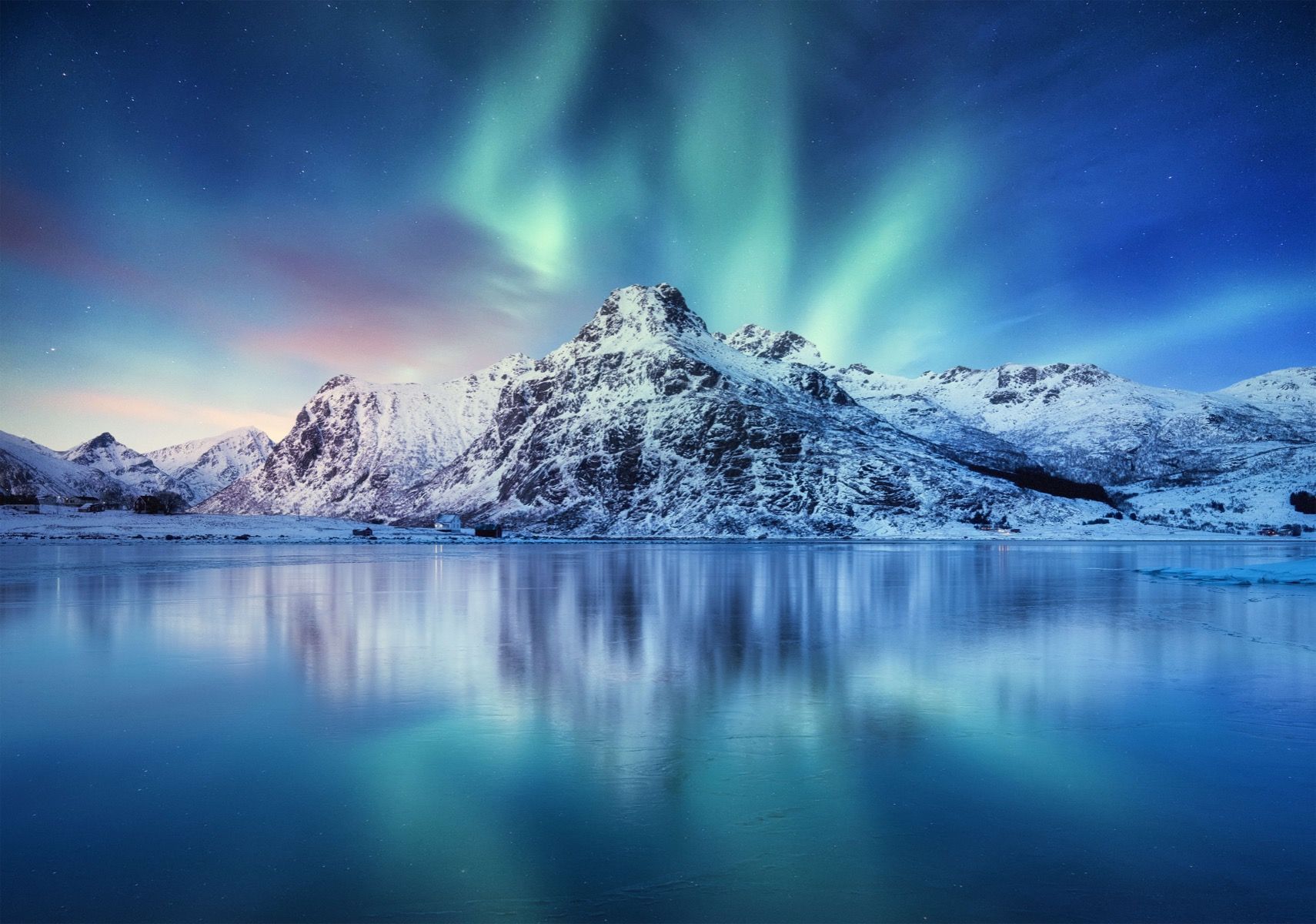 1710x1200 Northern lights over a frozen ocean and mountains