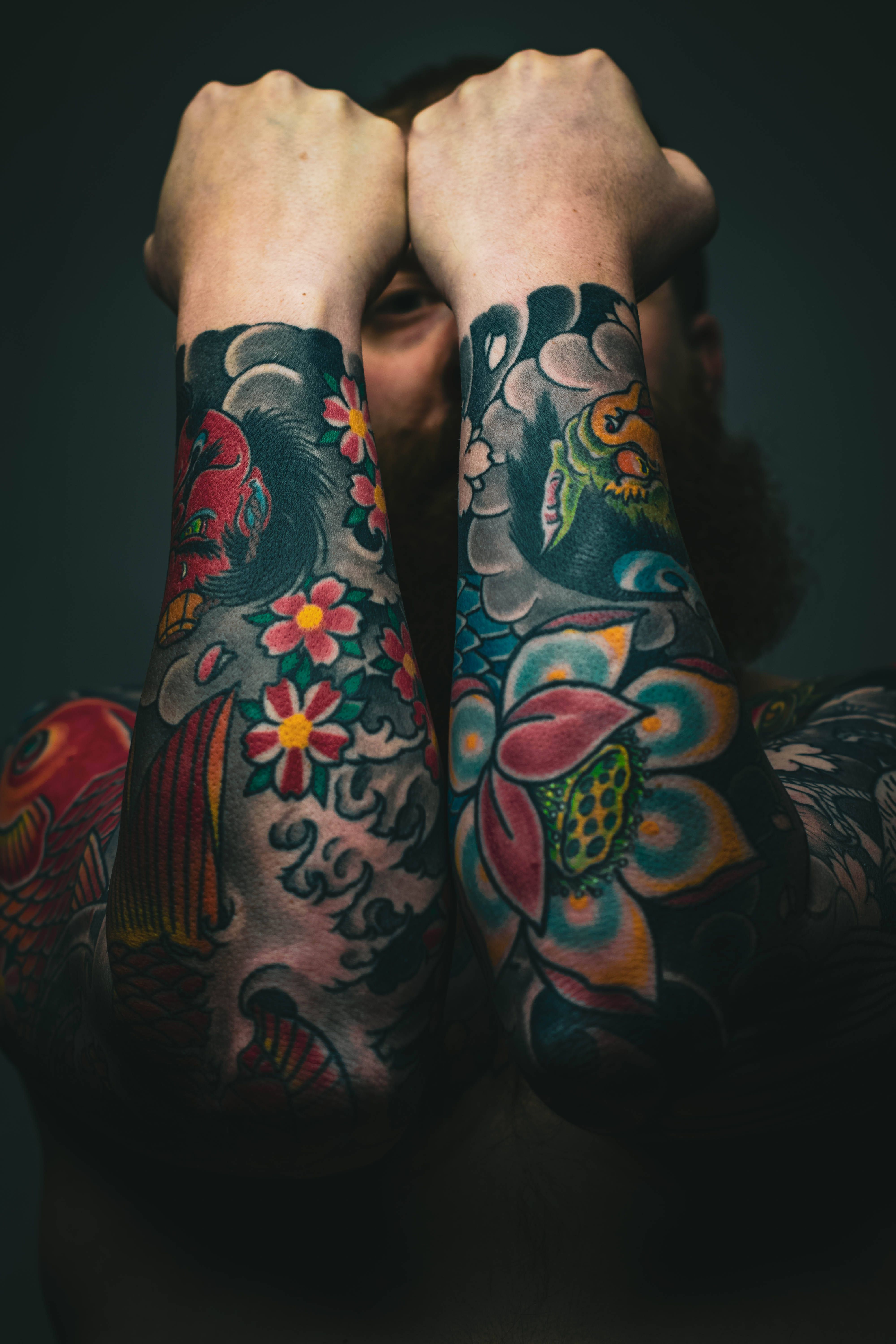 4000x6000 Download Intricate and Colorful HD Tattoo Design on Arms Wallpaper
