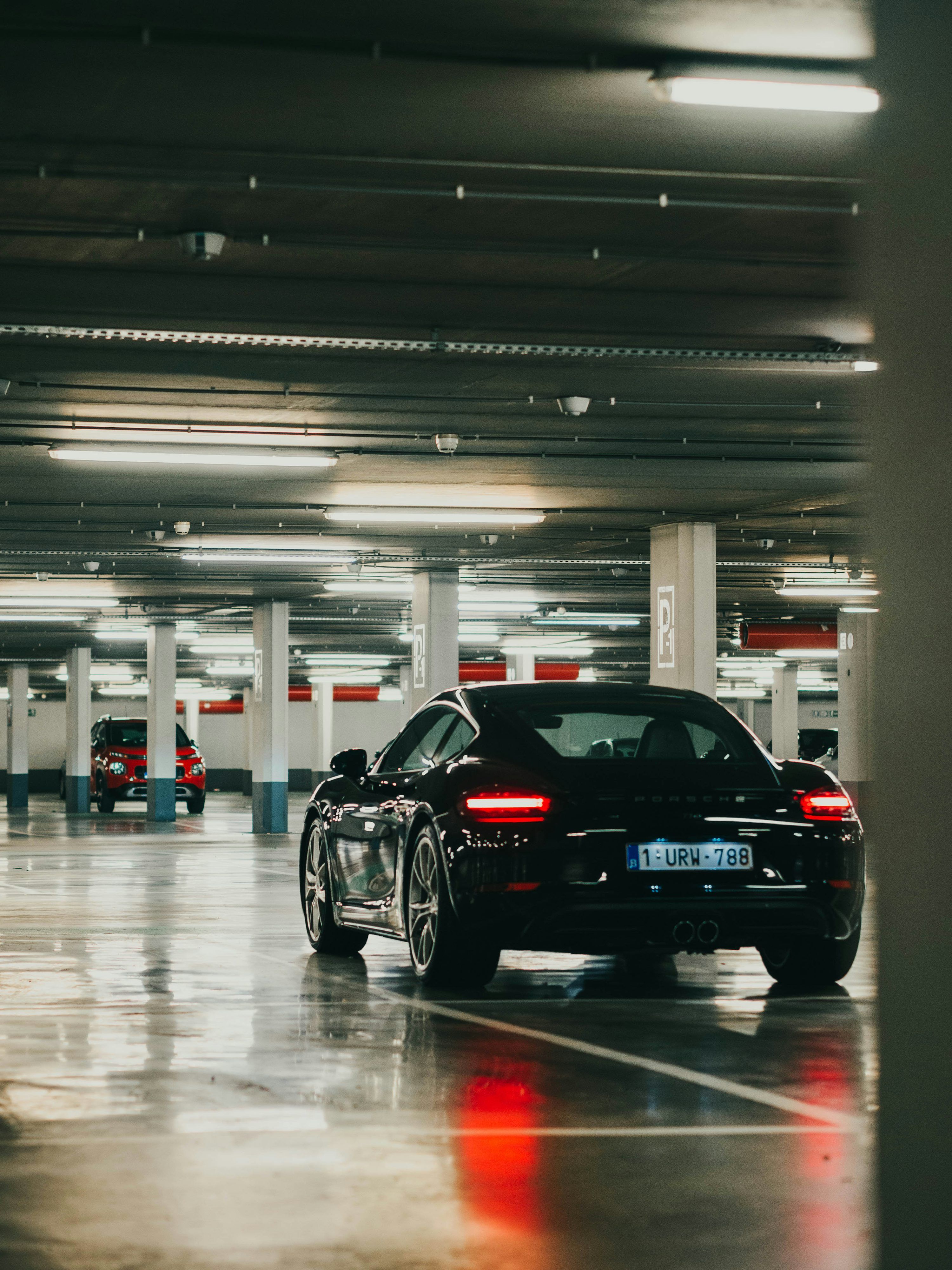 3000x4000 Black porsche 911 parked inside building