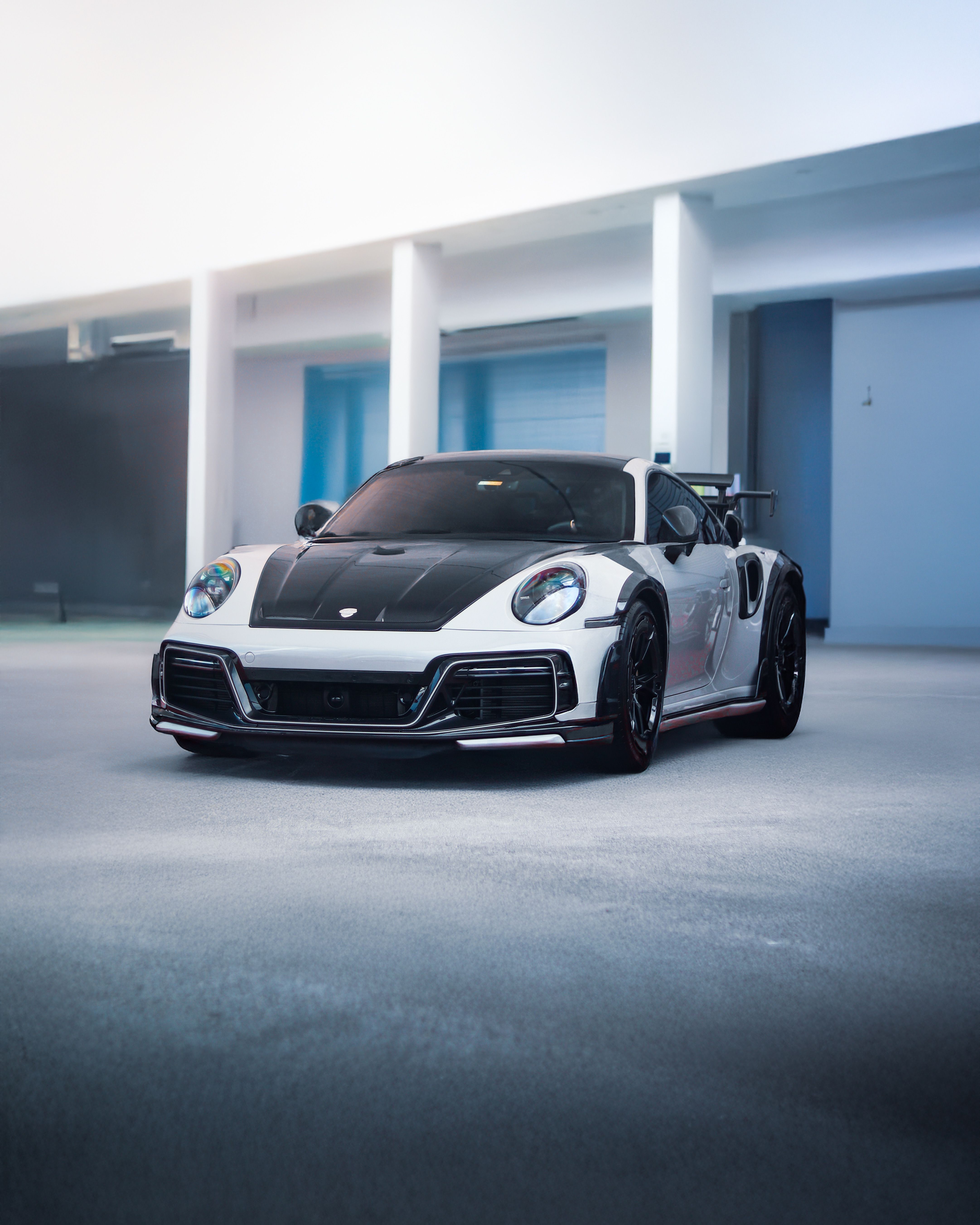 4325x5406 Sleek Sports Car in Modern Indoor Garage · Free