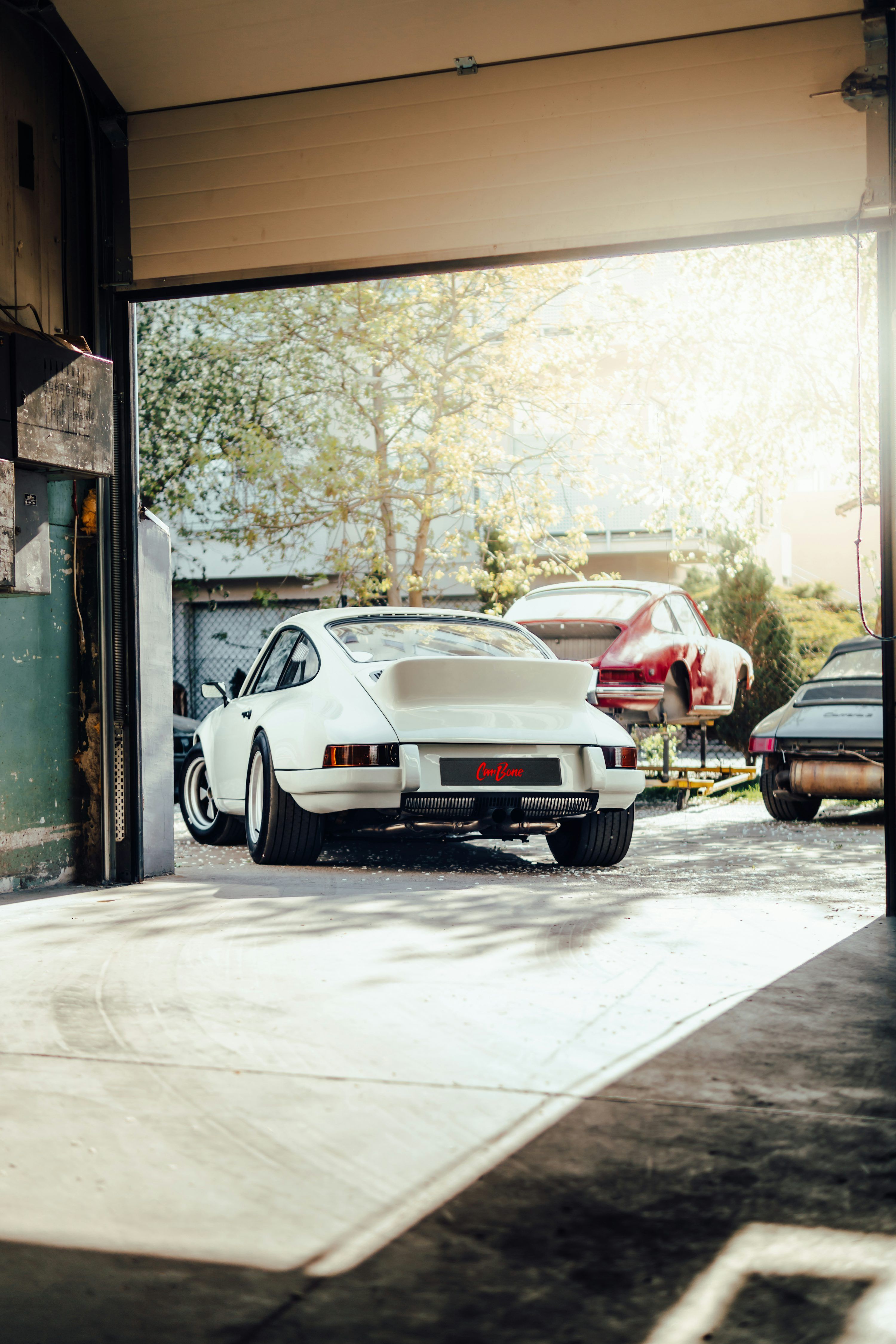3000x4500 A group of cars parked in a garage