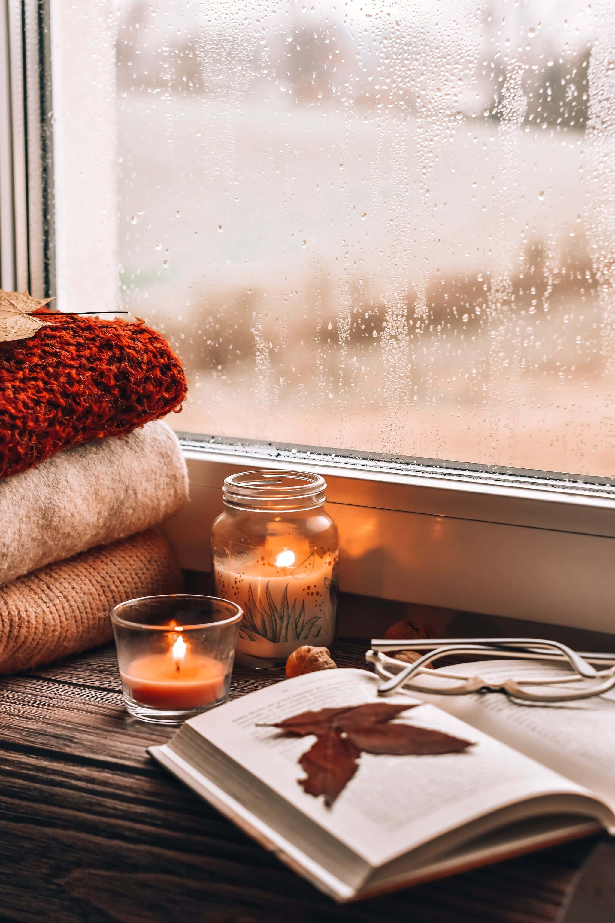 2048x3072 Download a window with candles, a book, and a blanket Wallpaper