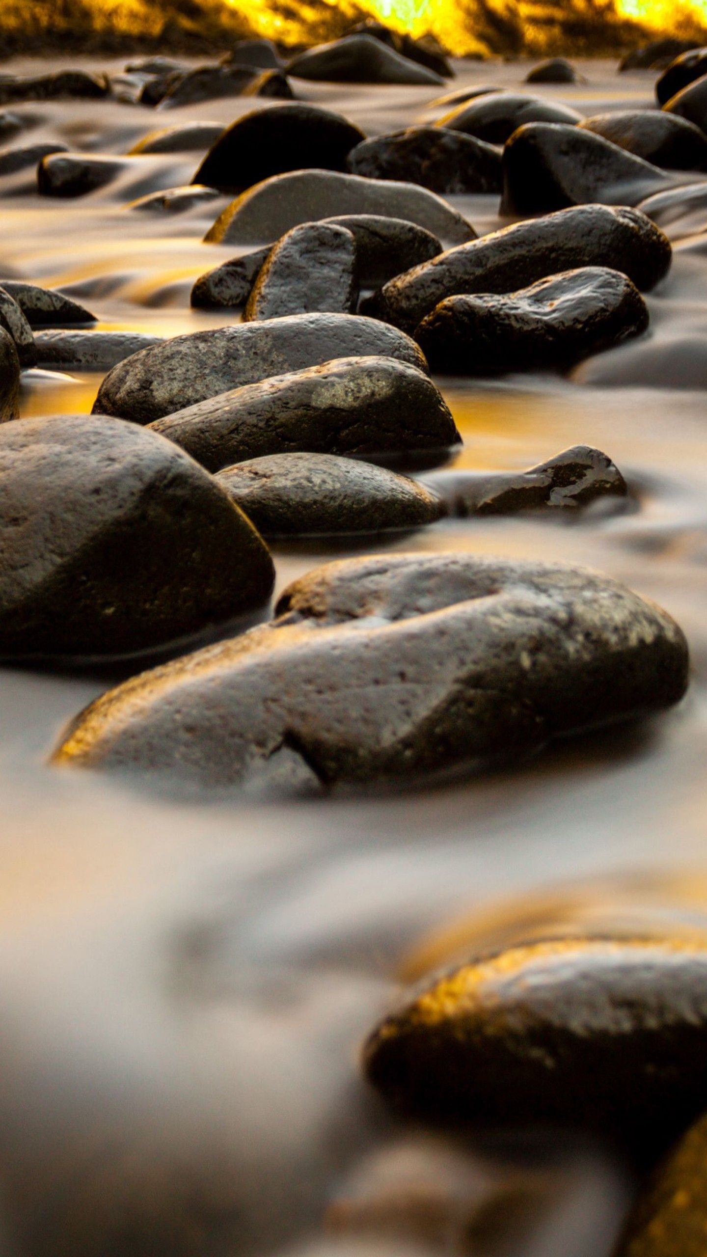 1440x2560 Closeup View Of Stones River Water Stream Long Exposure During Sunset 4K HD Nature Wallpaper