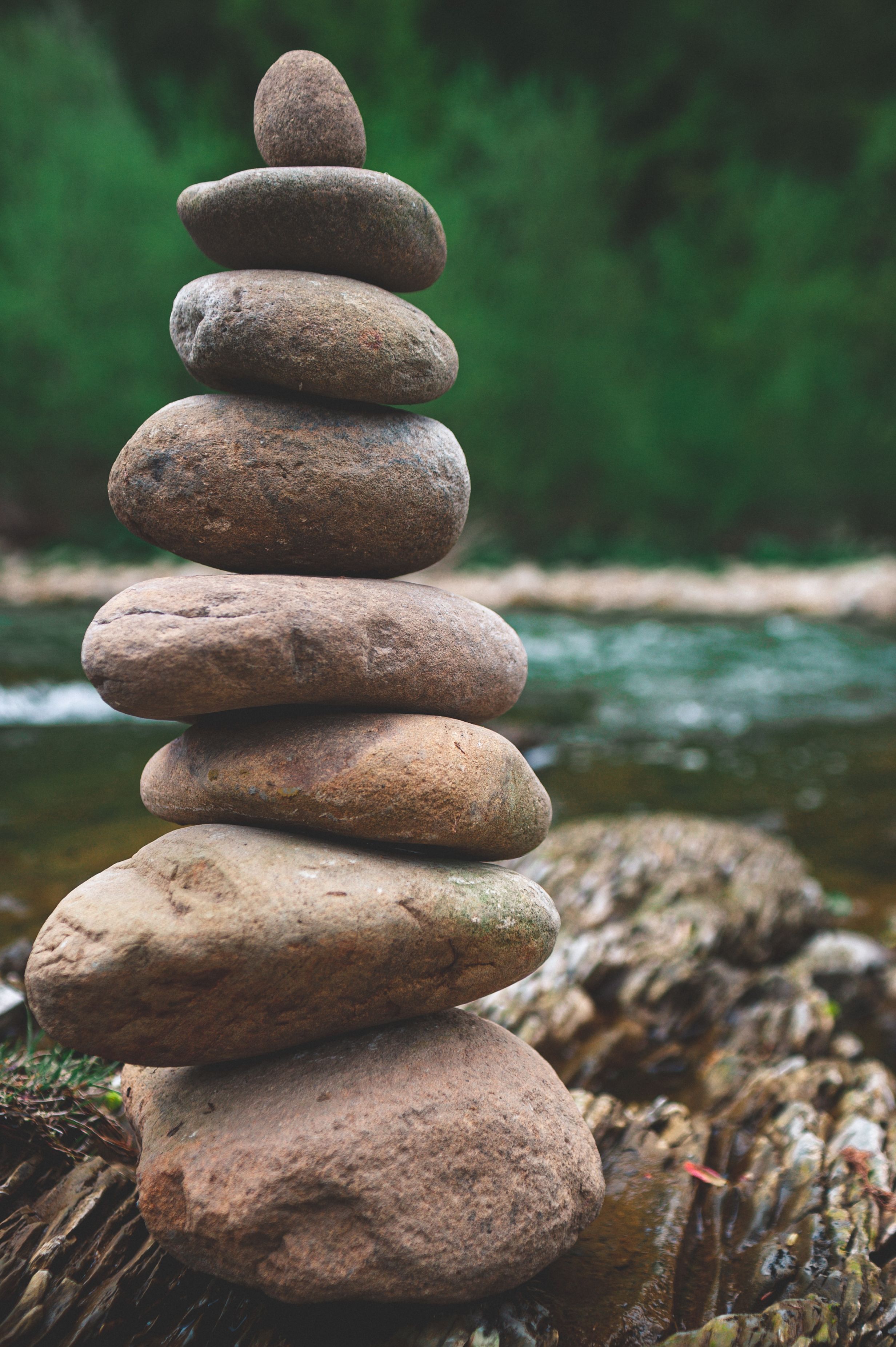 2464x3703 Stone Stacking Beside a River · Free