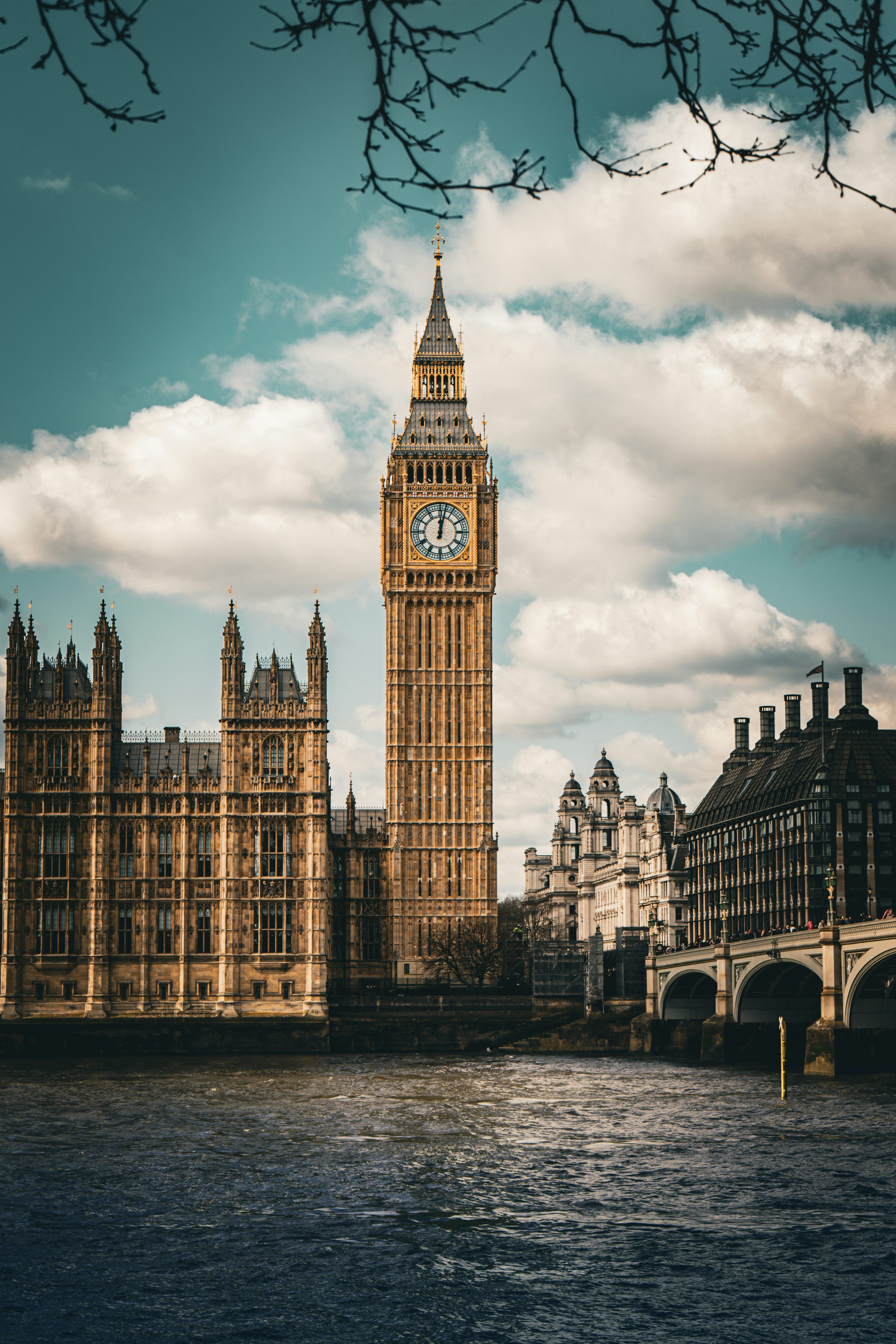 3000x4500 Big ben stands tall next to other buildings