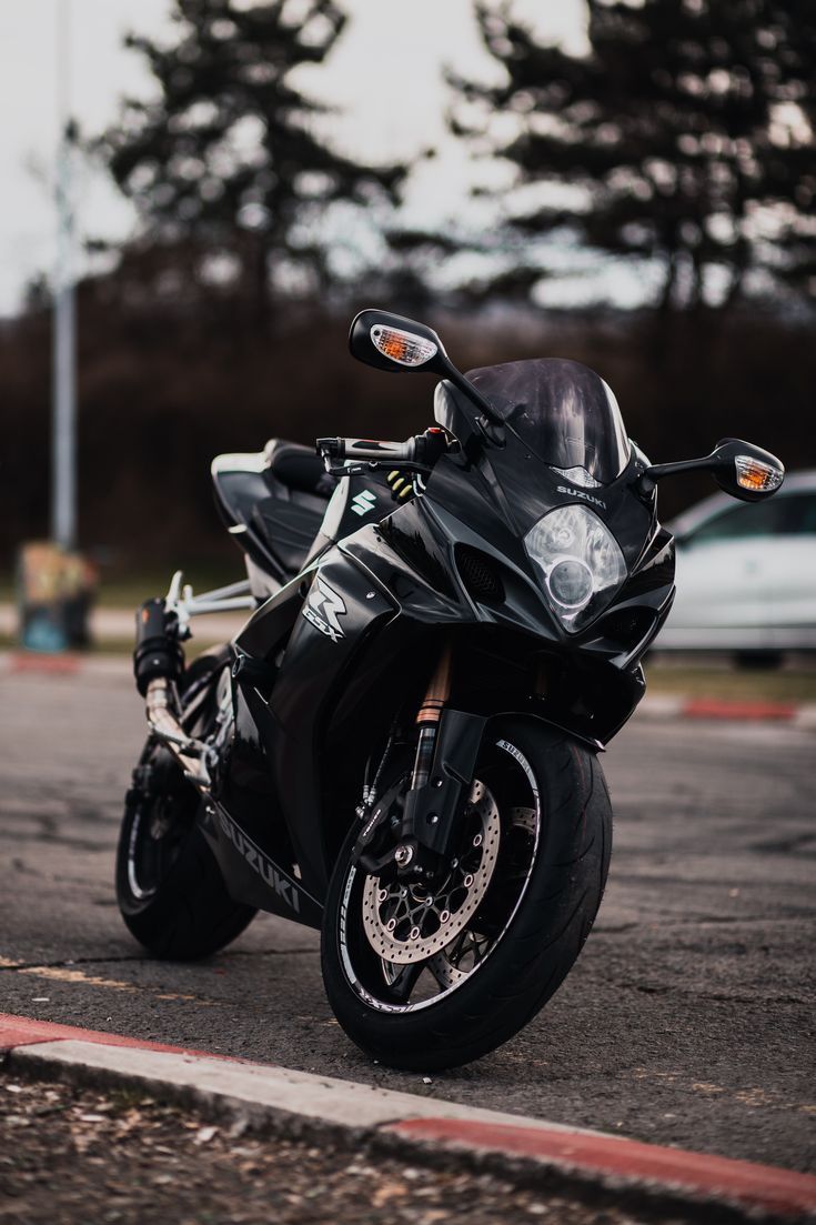 735x1103 Black suzuki motorcycle on road. Black suzuki sport motorcycle, Black sport motorcycle parked on grass, Motorcycle fairings