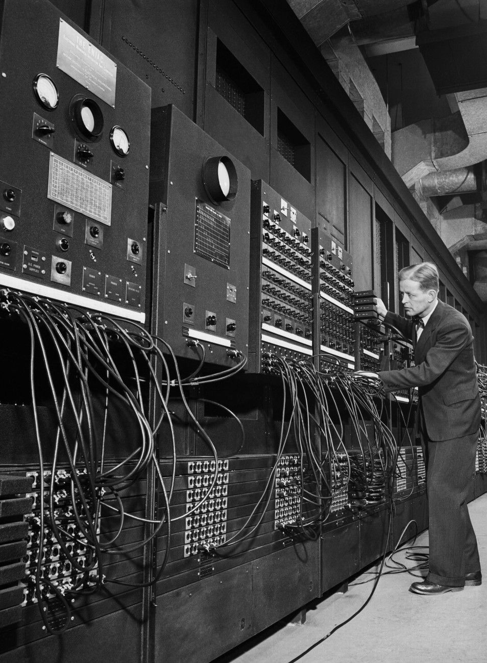 954x1300 Dr. J.W. Mauchly with the electronic computing machine known as the ENIAC. Association for Computing and Philosophy