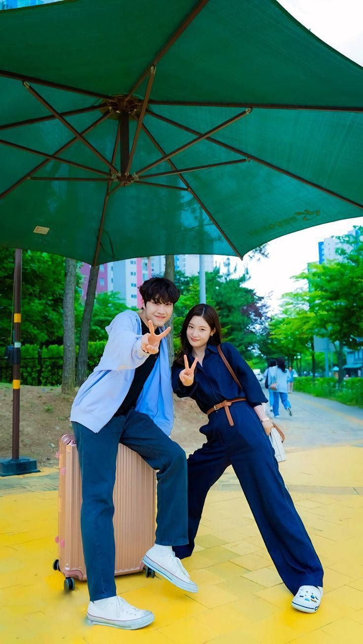 736x1306 Download Korean Couple Doing Peace Sign Wallpaper