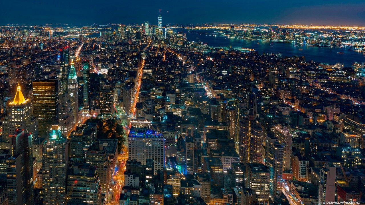 1280x720 Aerial View Of New York City With Shimmering Lights During Nighttime 4K HD Travel Wallpaper