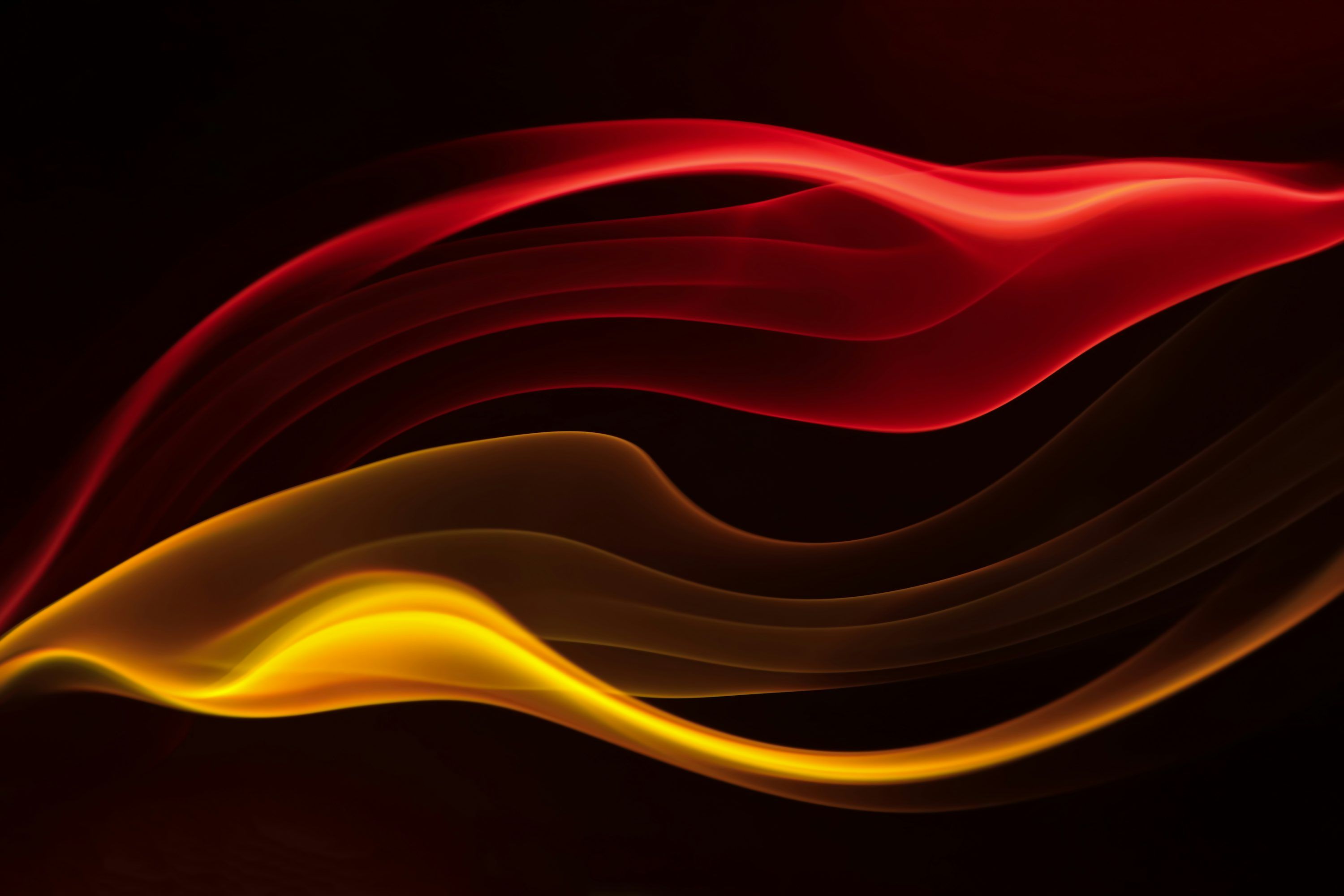 3000x2000 A red and yellow wave of smoke on a black background