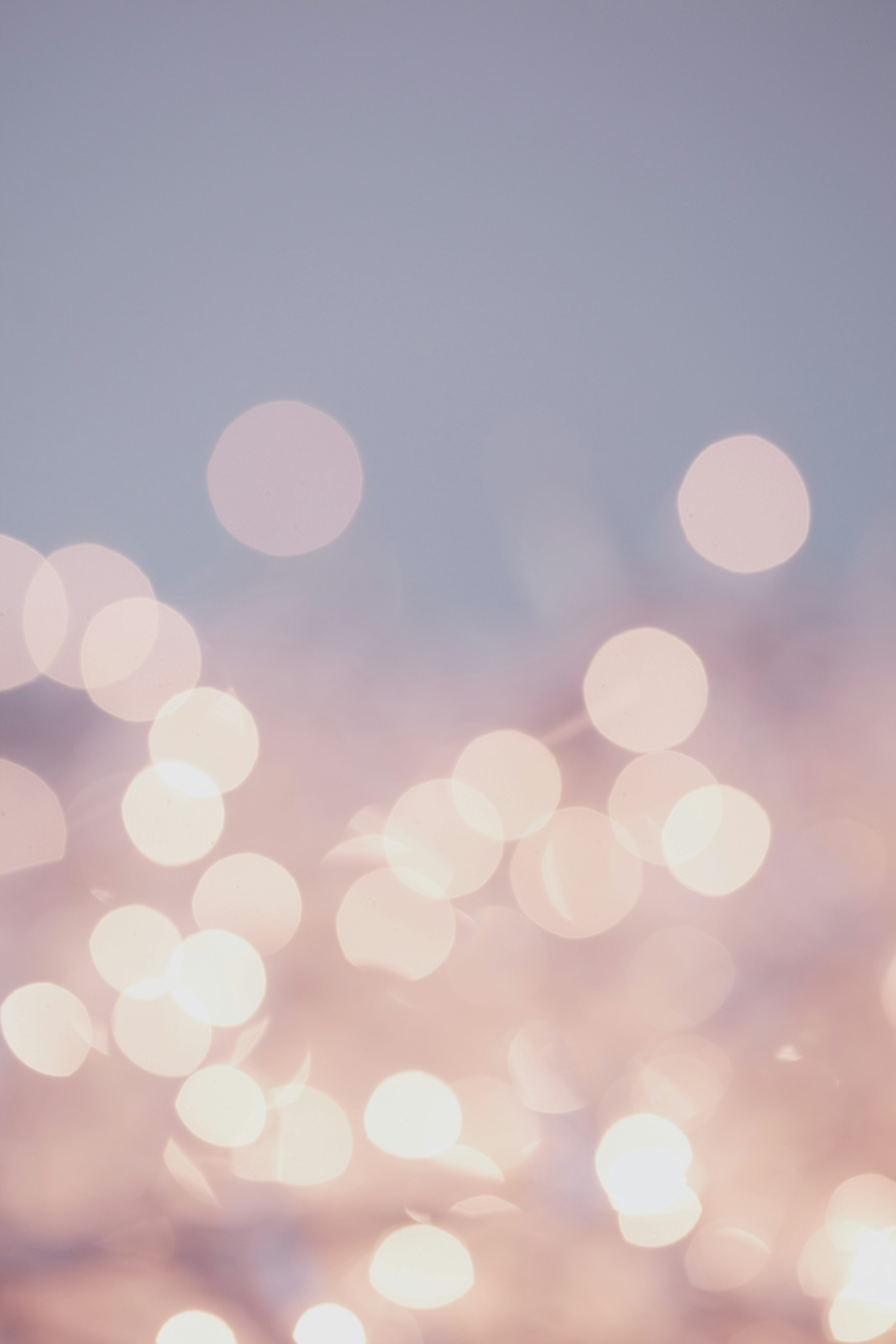 3000x4500 Soft pink bokeh lights against gray background