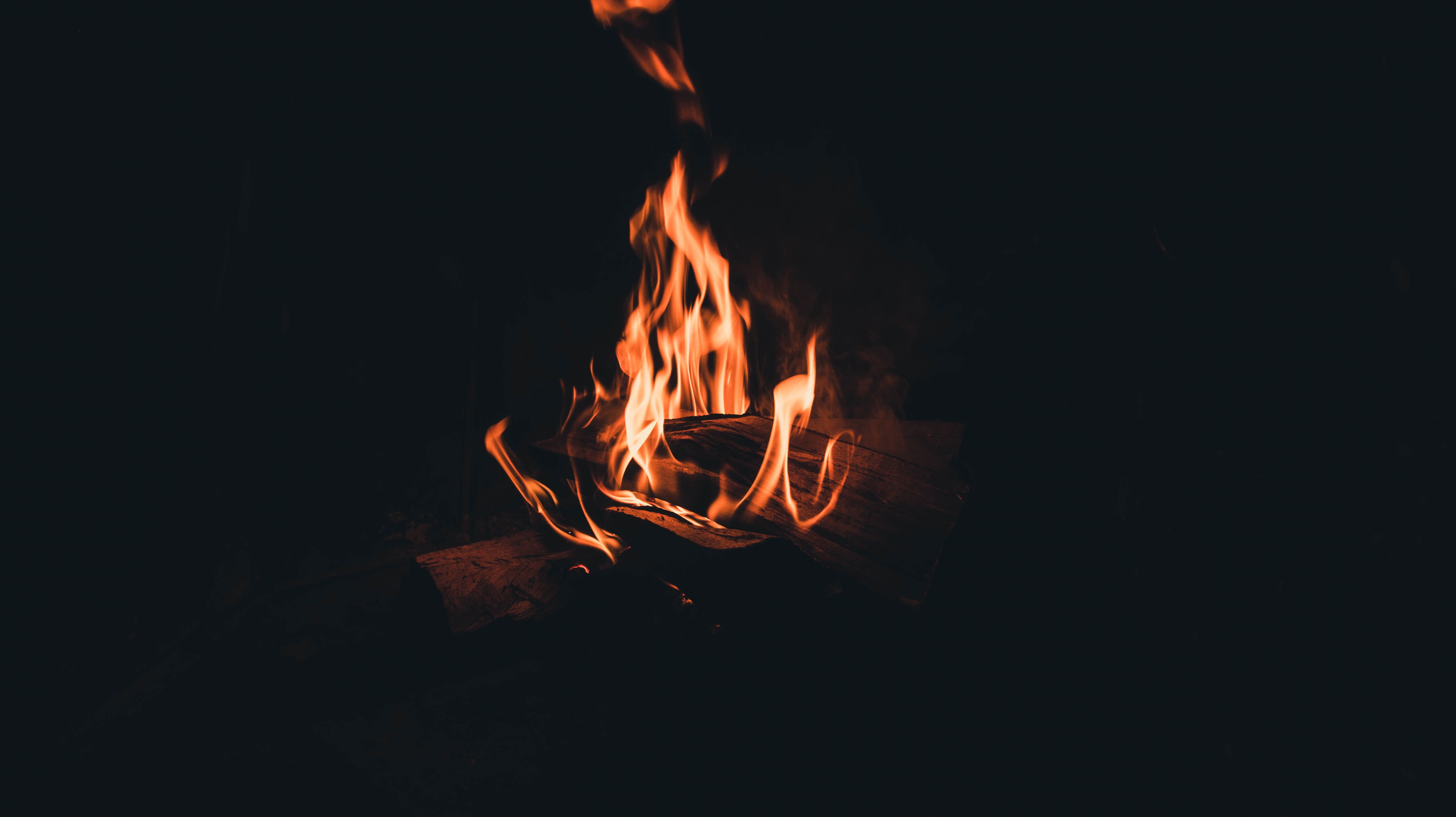 6000x3368 Download wallpaper 6000x3368 bonfire, fire, flame, firewood, night, darkness, dark HD background