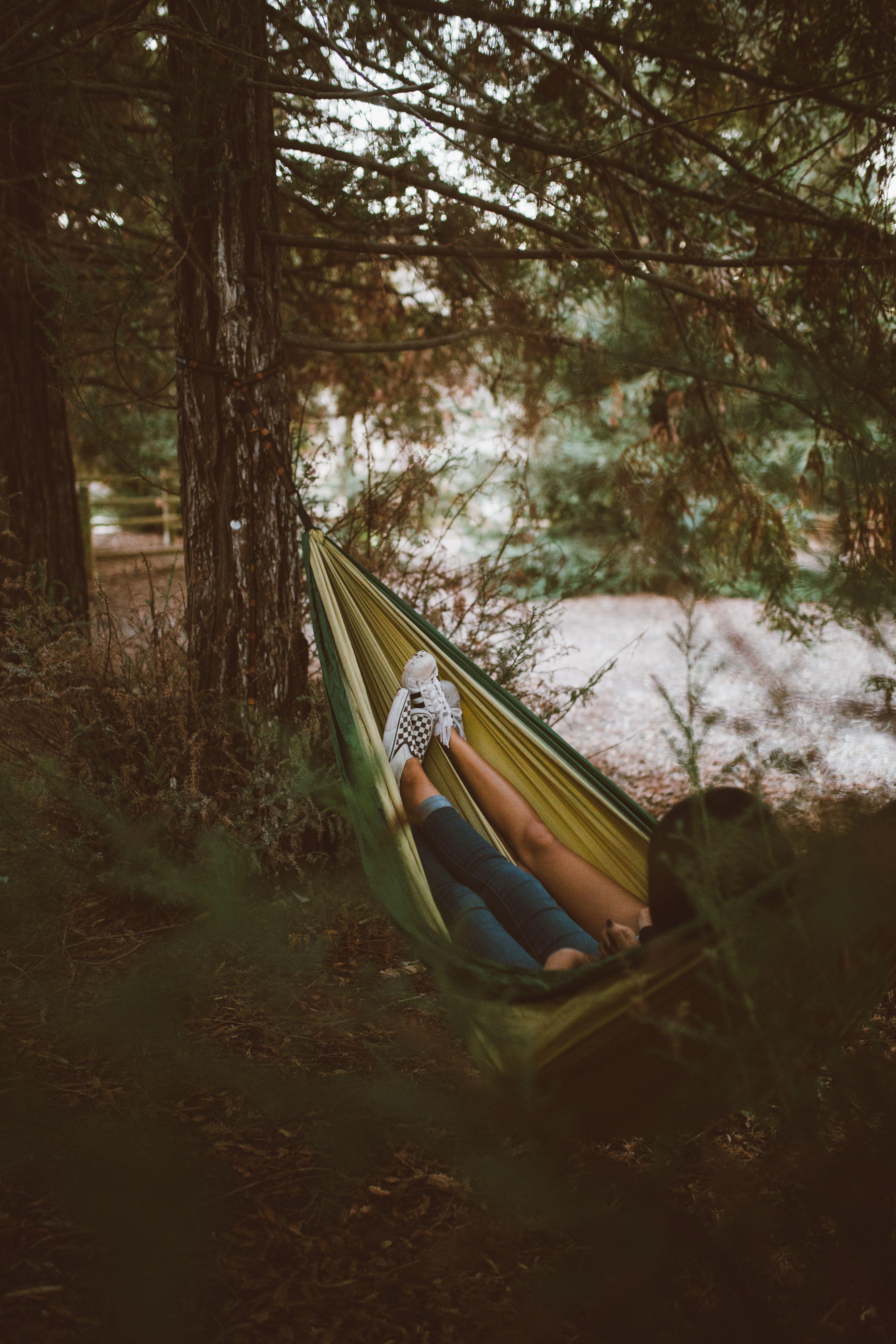 3648x5472 Download wallpaper 3648x5472 hammock, legs, camping, recreation, forest, travel HD background