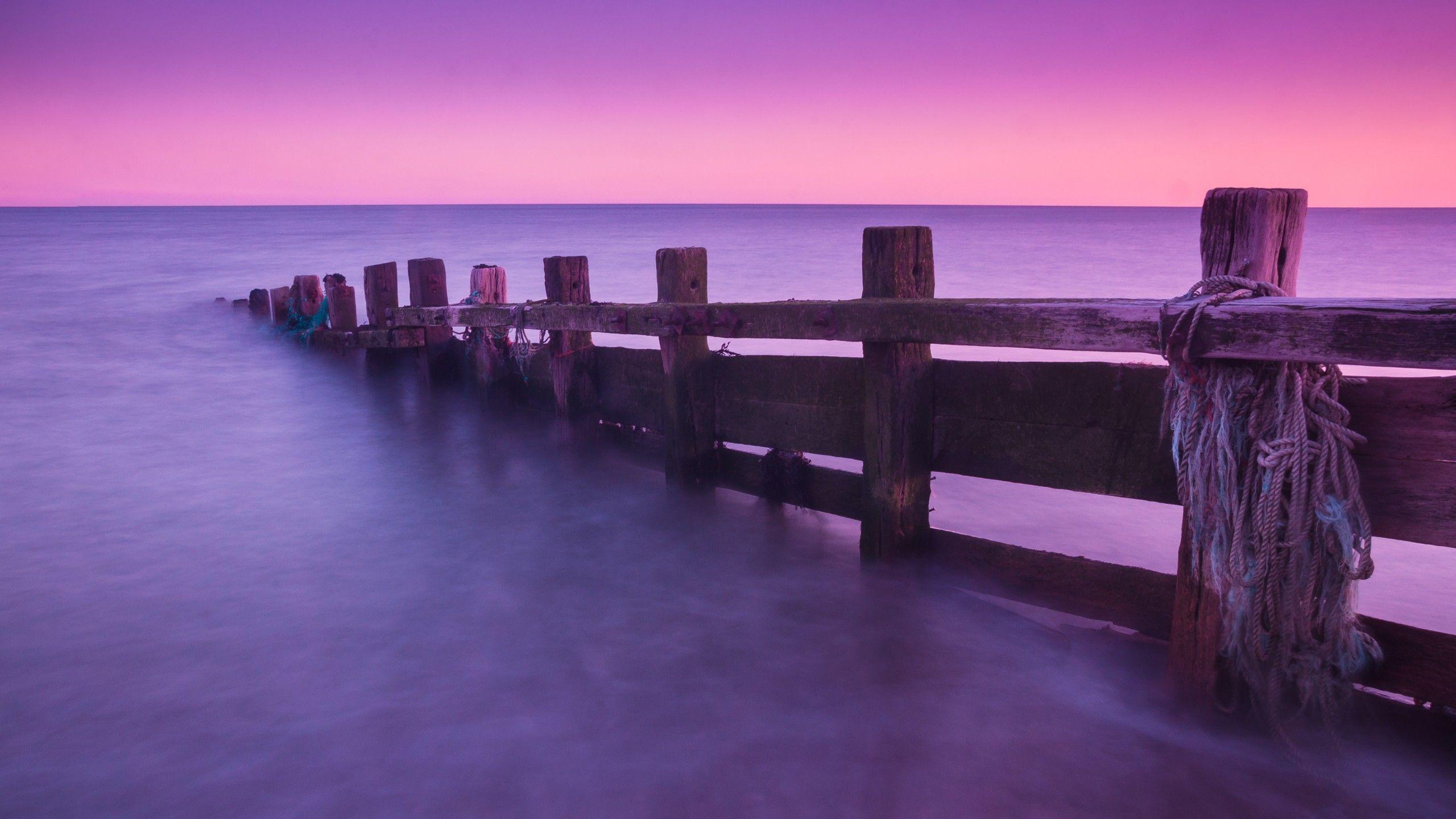2560x1440 Wallpaper docks, 4k, HD wallpaper, abandoned, Seven Sisters Country Park, England, purple, pink, sunrise, sunset, sea, ocean, water, clear sky, OS