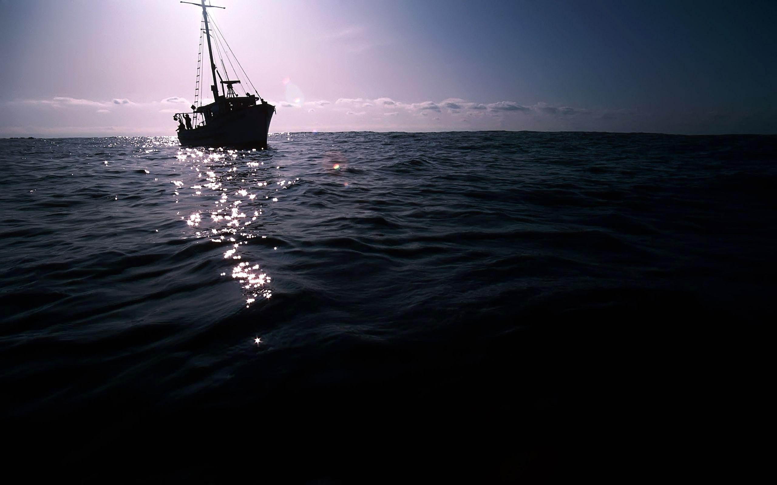 2560x1600 The Dark Boat On Sea MacBook Air Wallpaper Download
