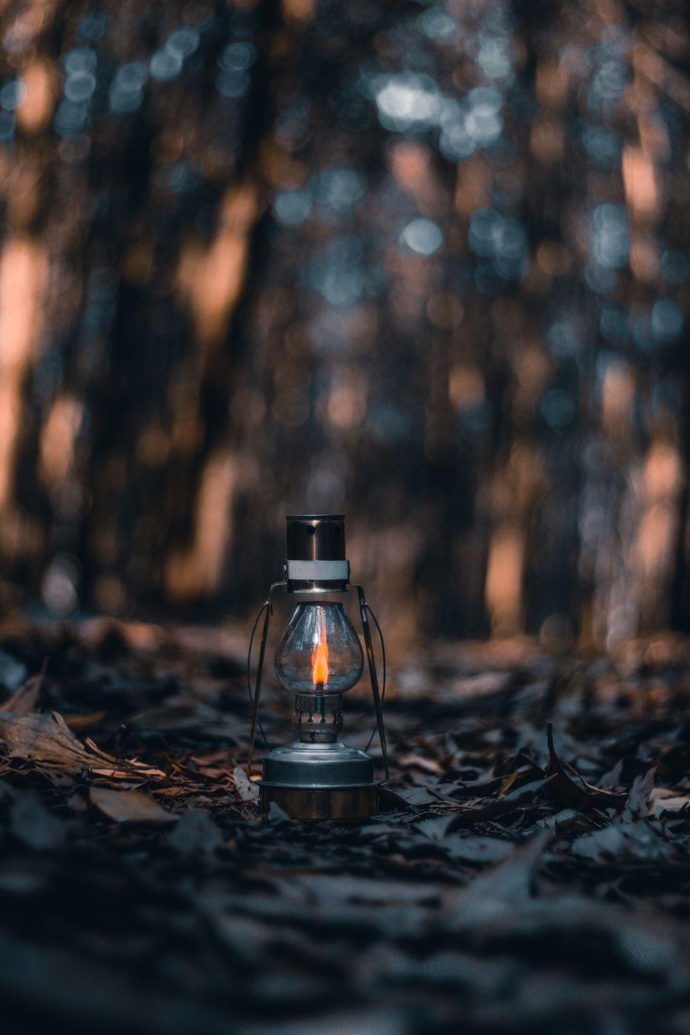 1000x1500 oil lamp on the ground photo