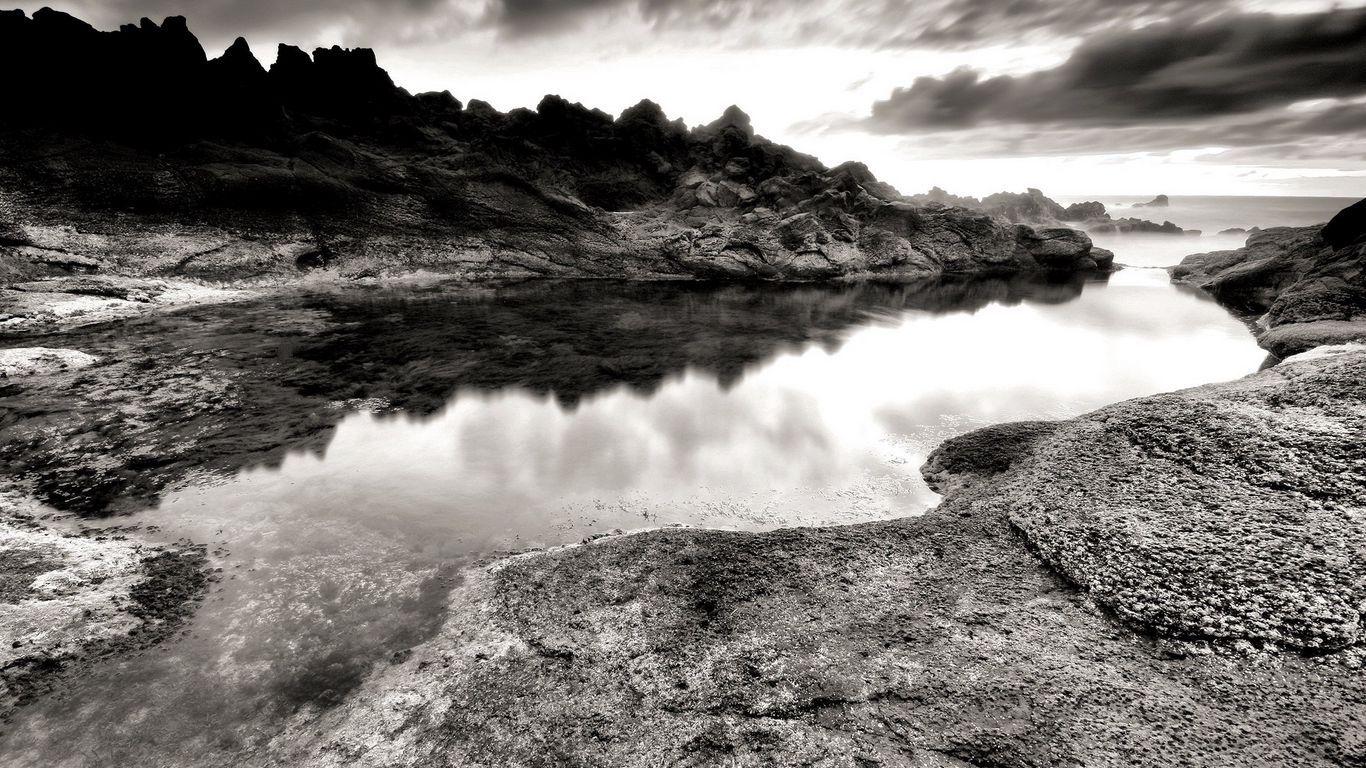 1366x768 Download Wallpaper 1366x768 Sea, Stones, Coast, Rocks, Despondency, Black And White Tablet, Laptop HD Background