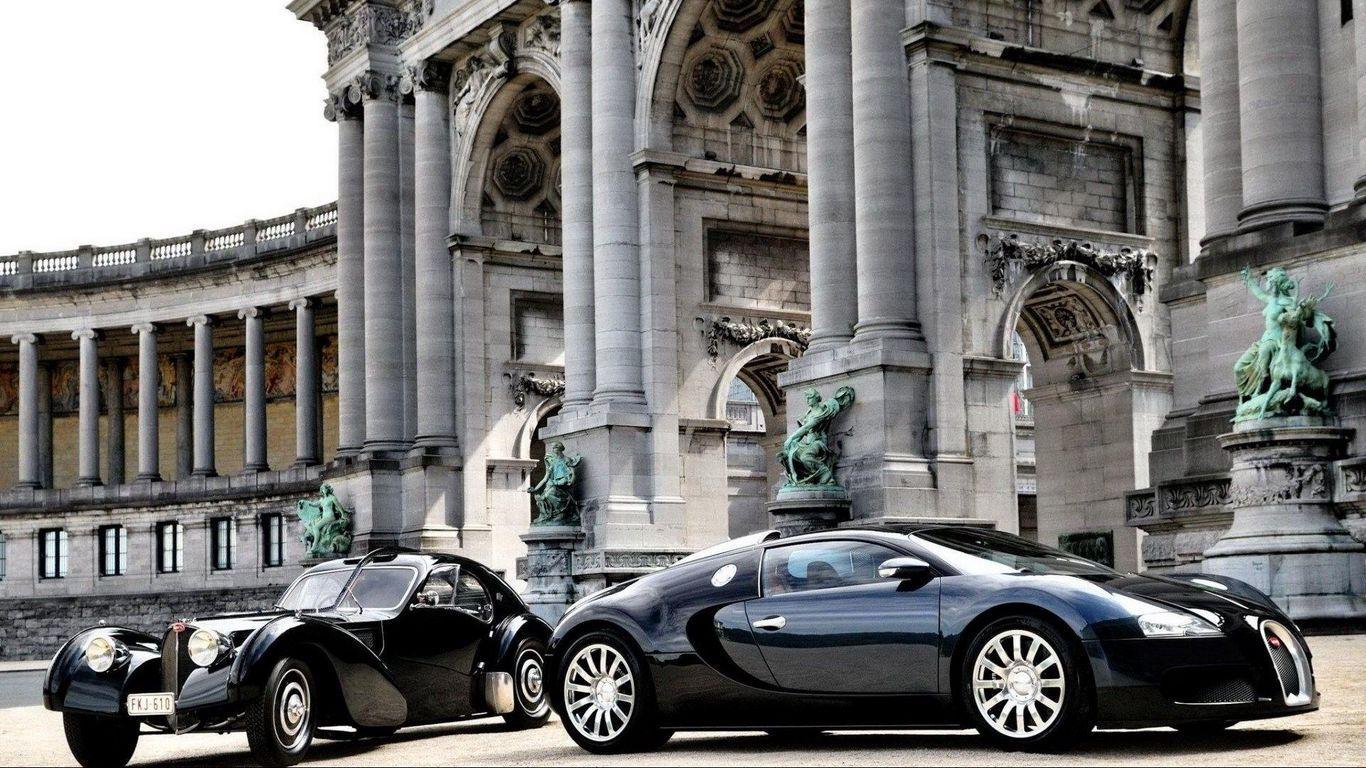1366x768 Download wallpaper 1366x768 cars, bugatti, veyron, luxury, black, parked, building tablet, laptop HD background