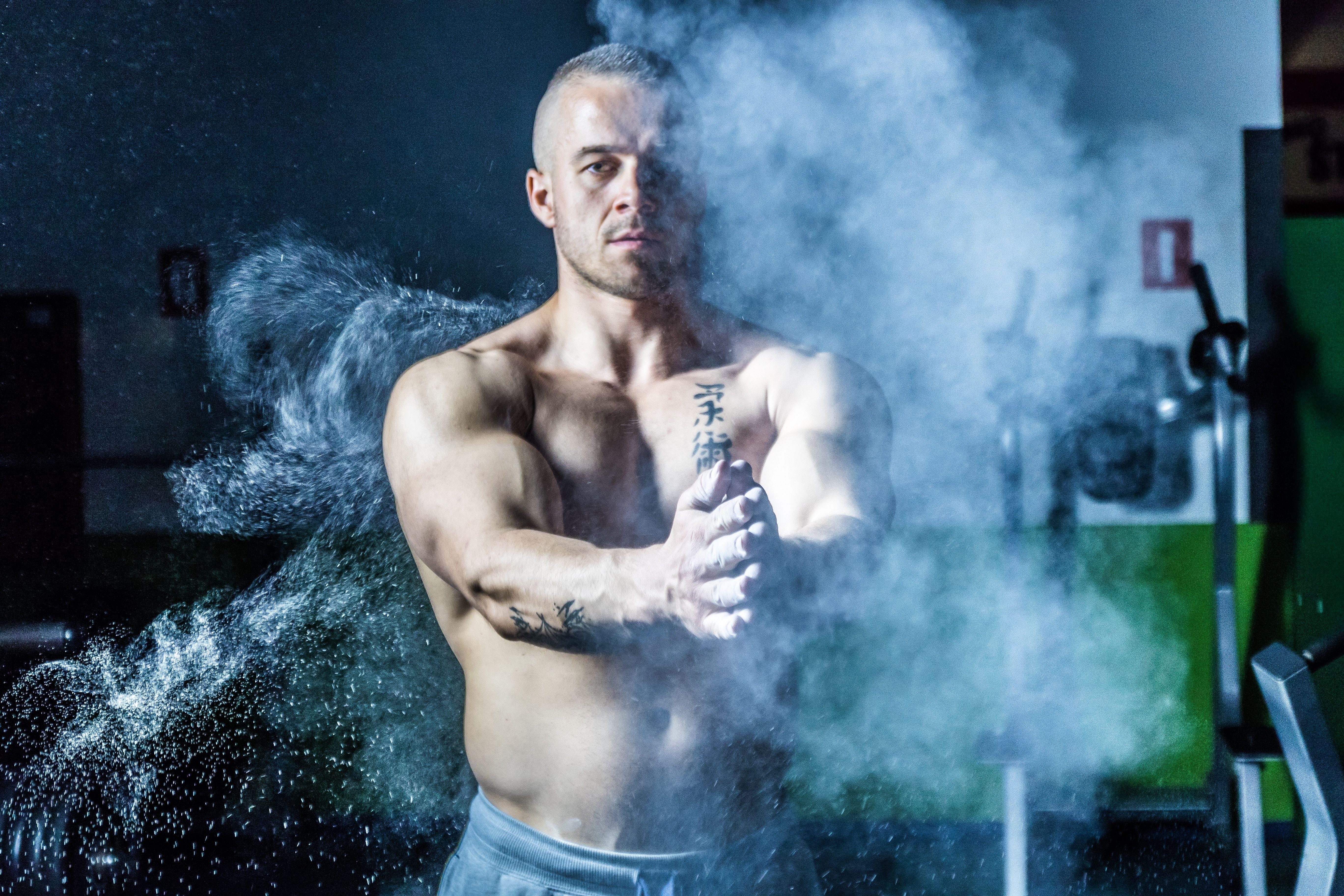 5472x3648 Topless Man Standing Near Exercise Equipment Inside