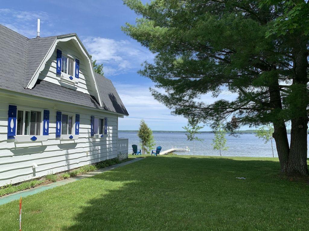 1024x768 Enjoy all four seasons at the Swiss Chalet located on the shore of Burt Lake