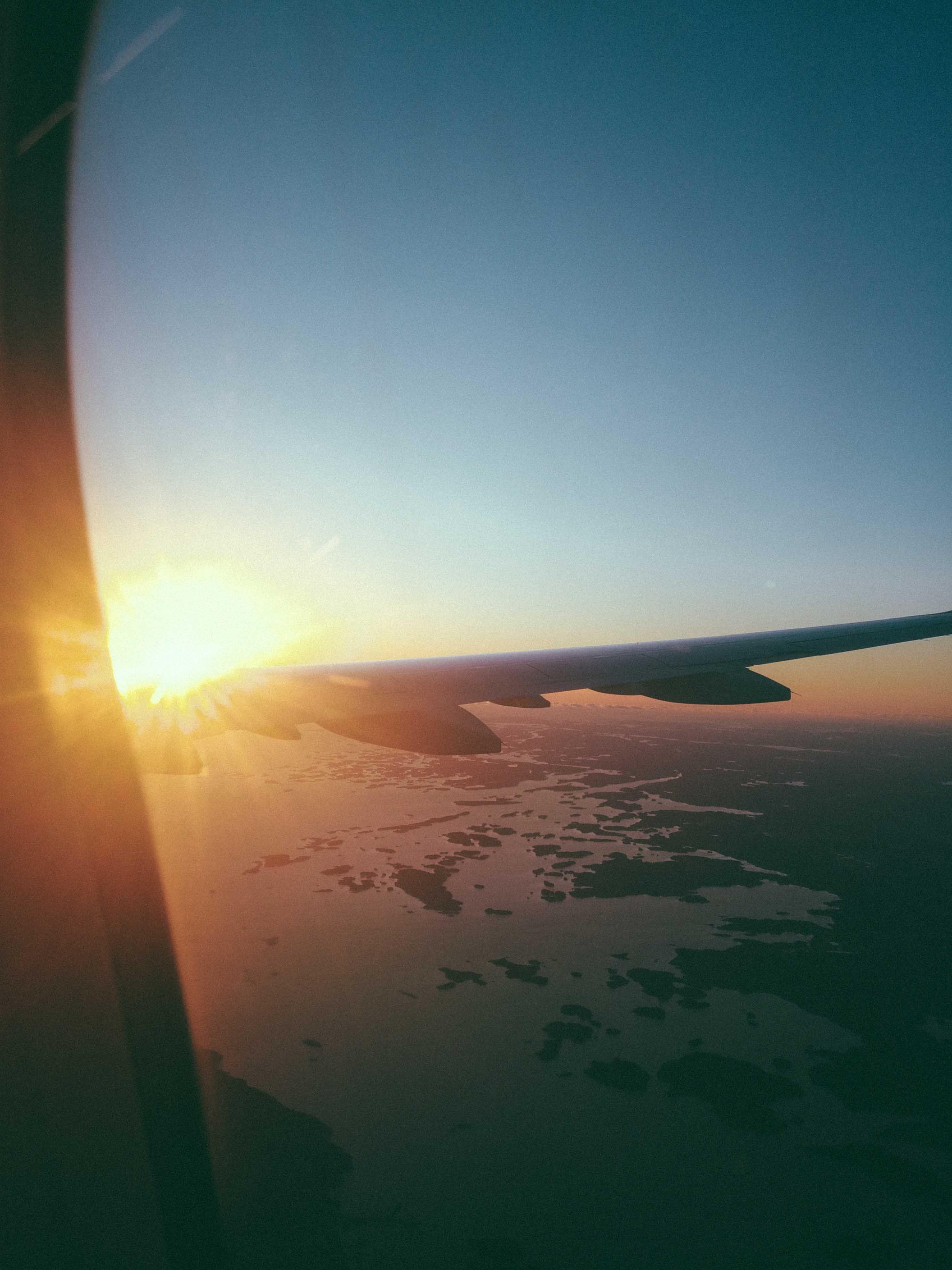 2976x3968 Airplane Window View of Sunrise · Free