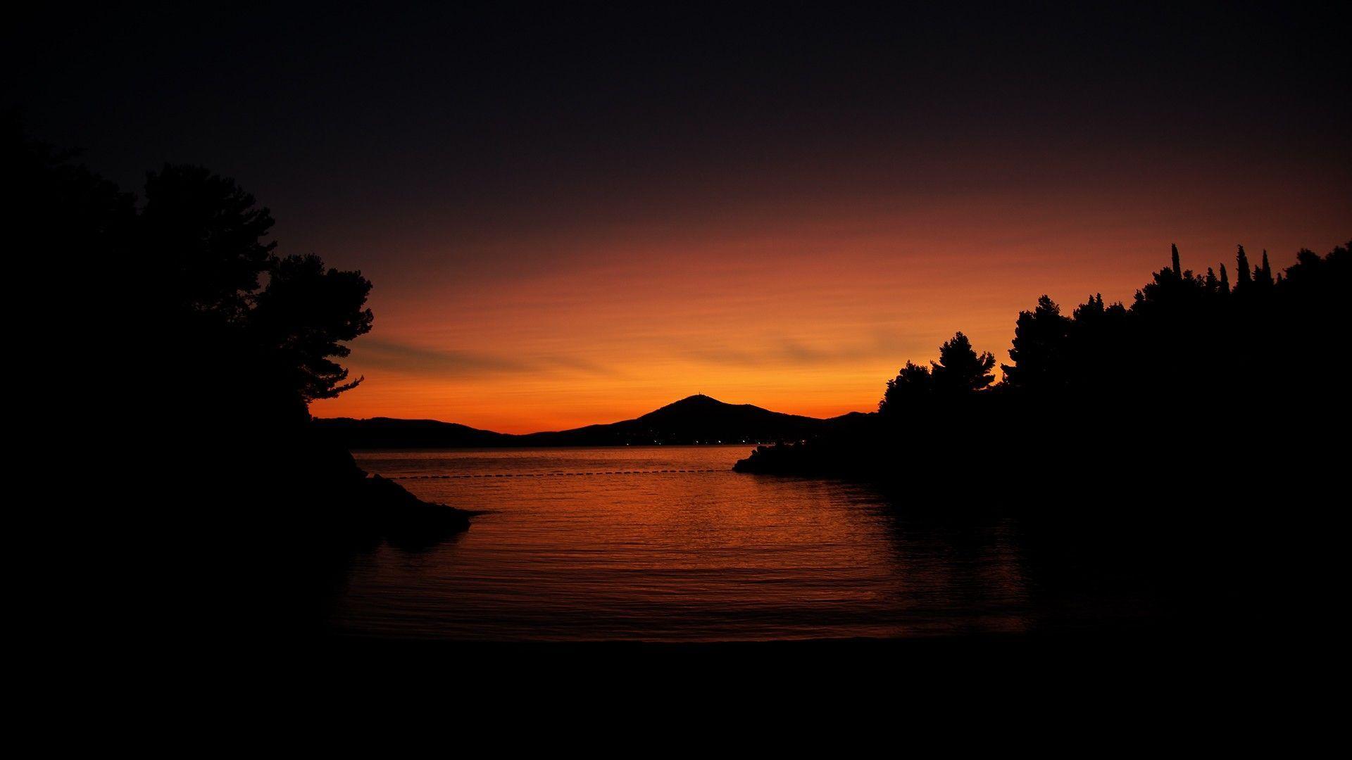 1920x1080 calm, #water, #nature, #dark, #hills, #orange, #sunlight, #sunset, #trees, wallpaper. Sunset, Sunset artwork, Sunset wallpaper