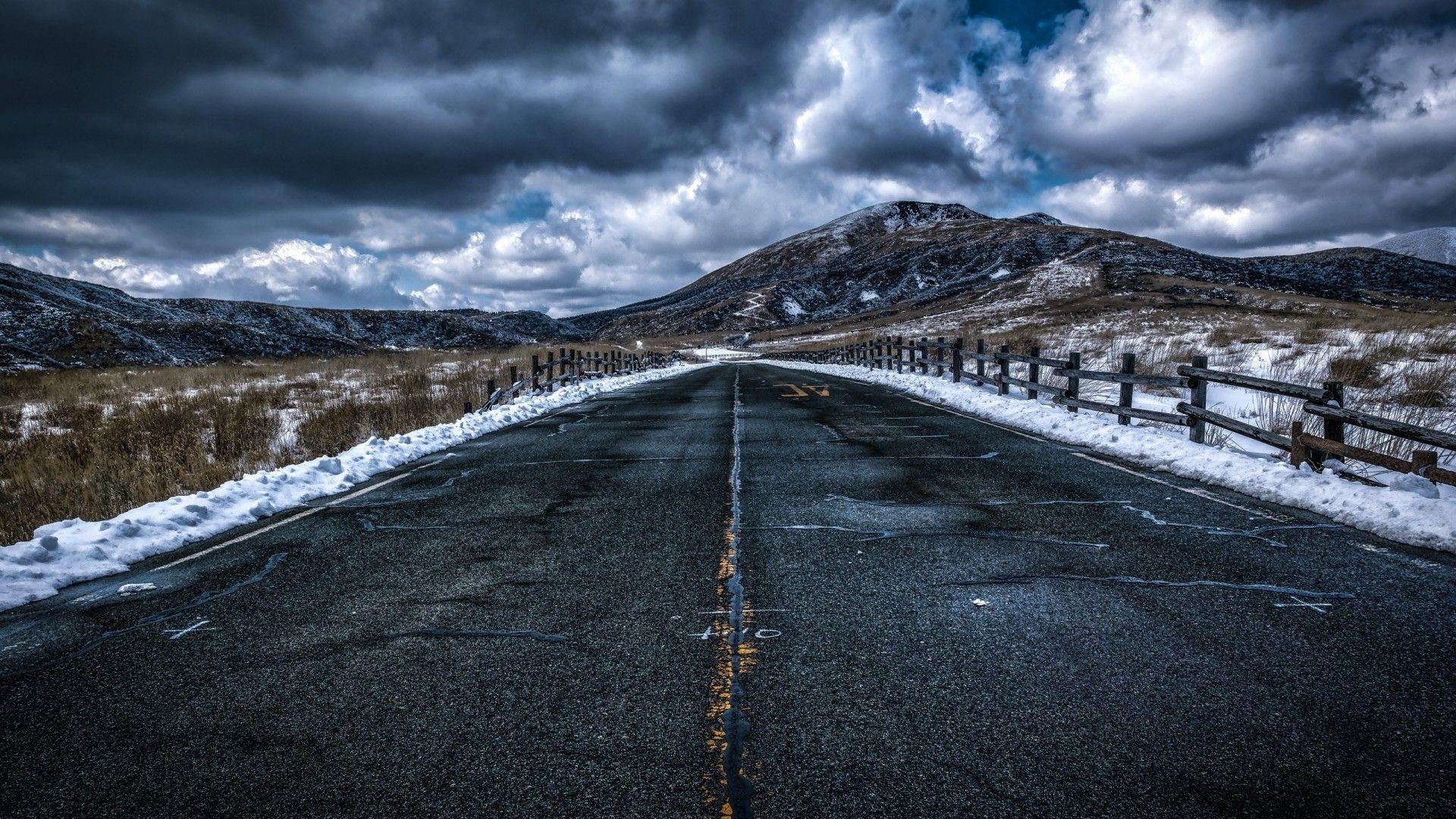 1920x1080 Download 1920x1080 Dark Clouds, Long Road, Snow, Hills Wallpaper for Widescreen