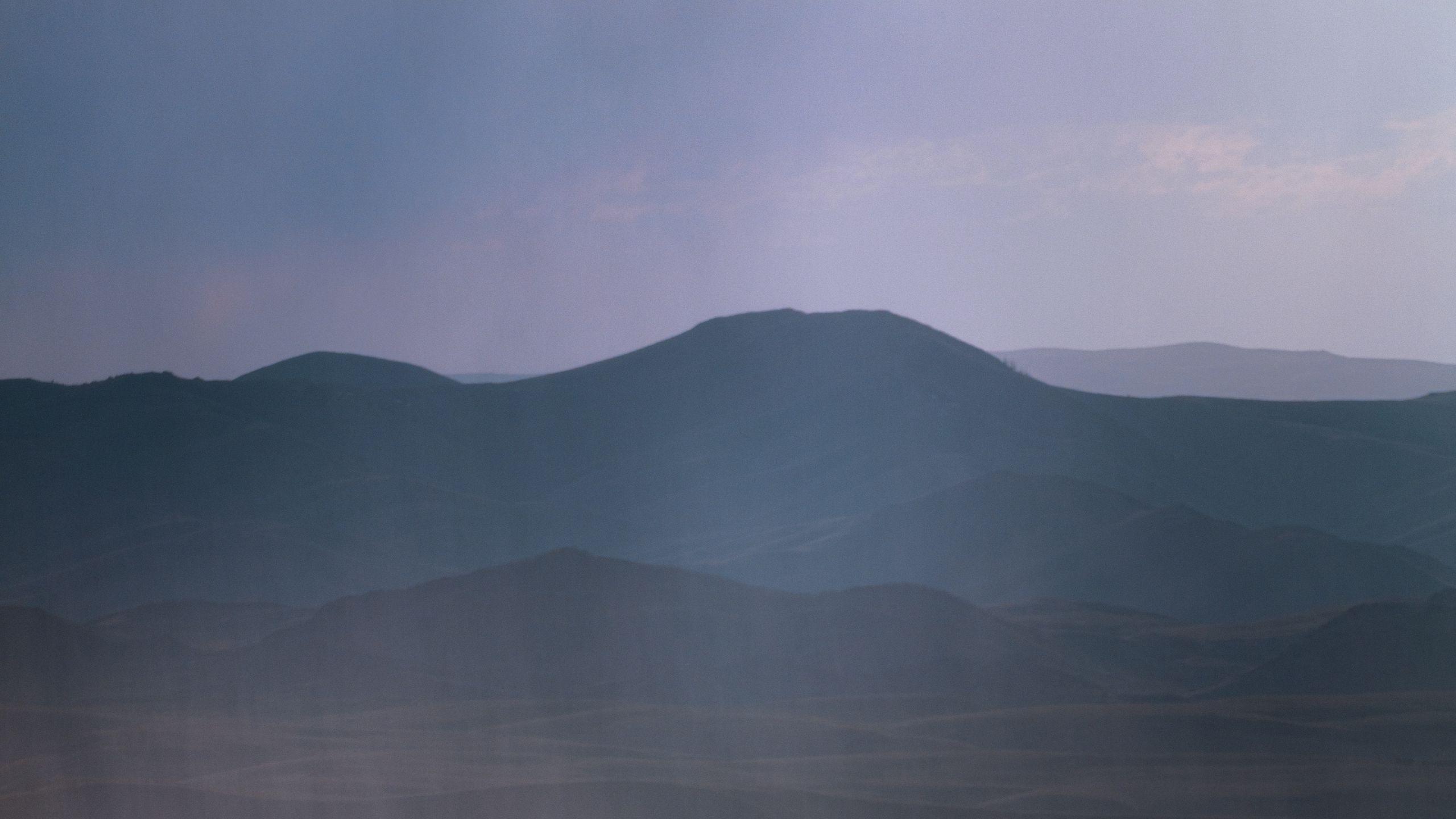 2560x1440 Download wallpaper 2560x1440 mountains, hills, fog, landscape, dark widescreen 16:9 HD background