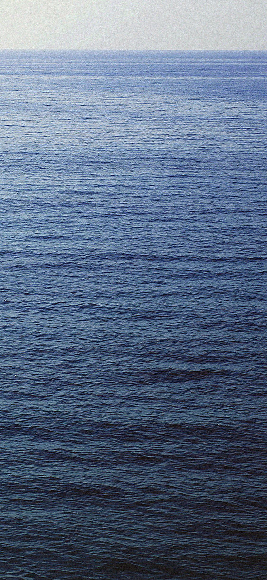 1125x2436 wallpaper back to sea dark blue minimal