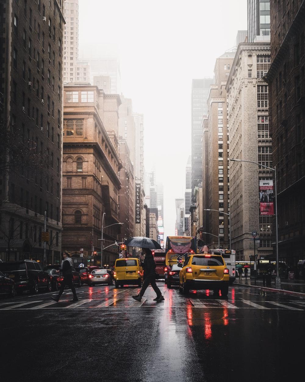 1000x1250 person walking on pedestrian lane between buildings photo