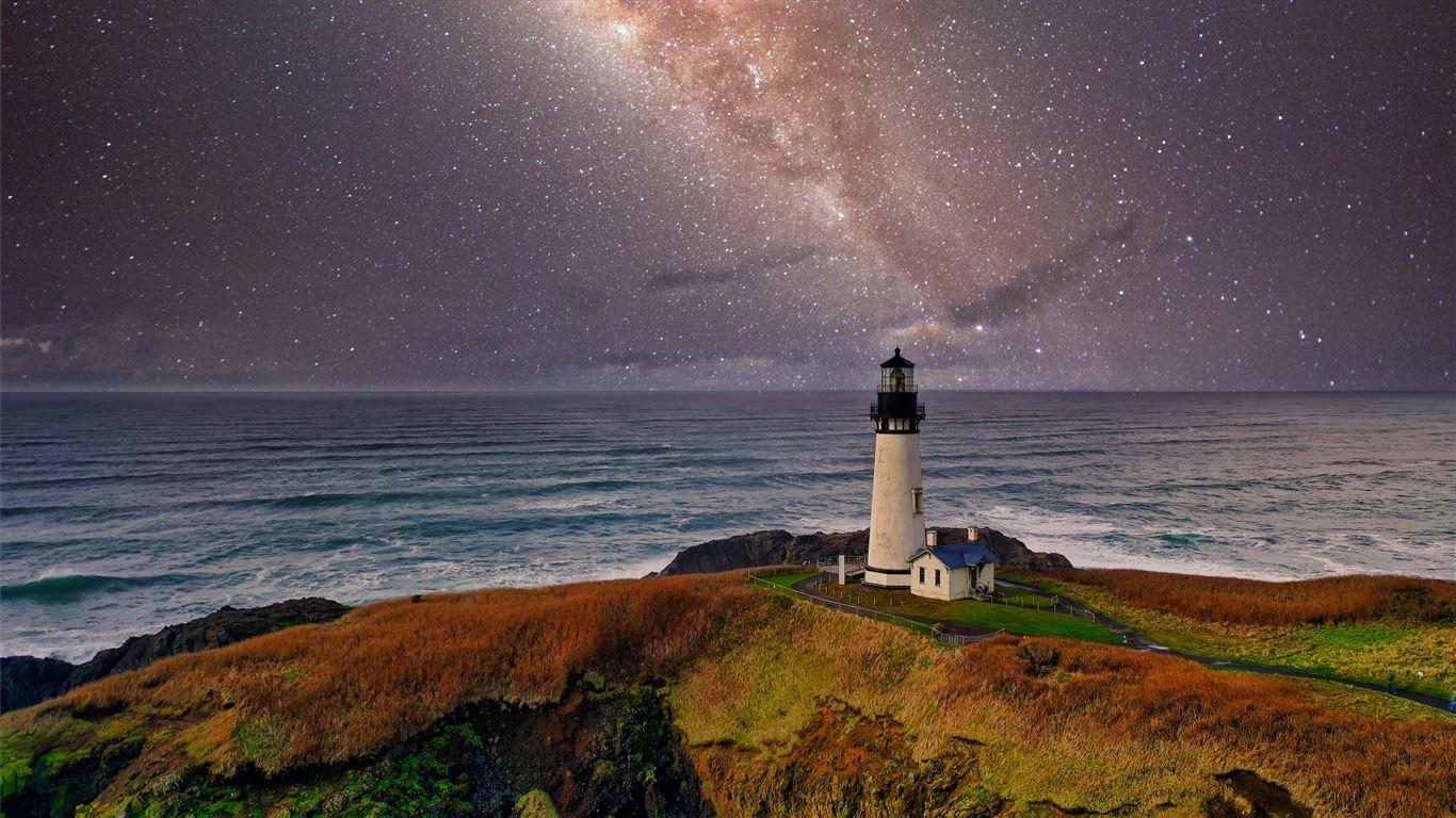1366x768 lighthouse under starry night MacBook Pro Wallpaper Download