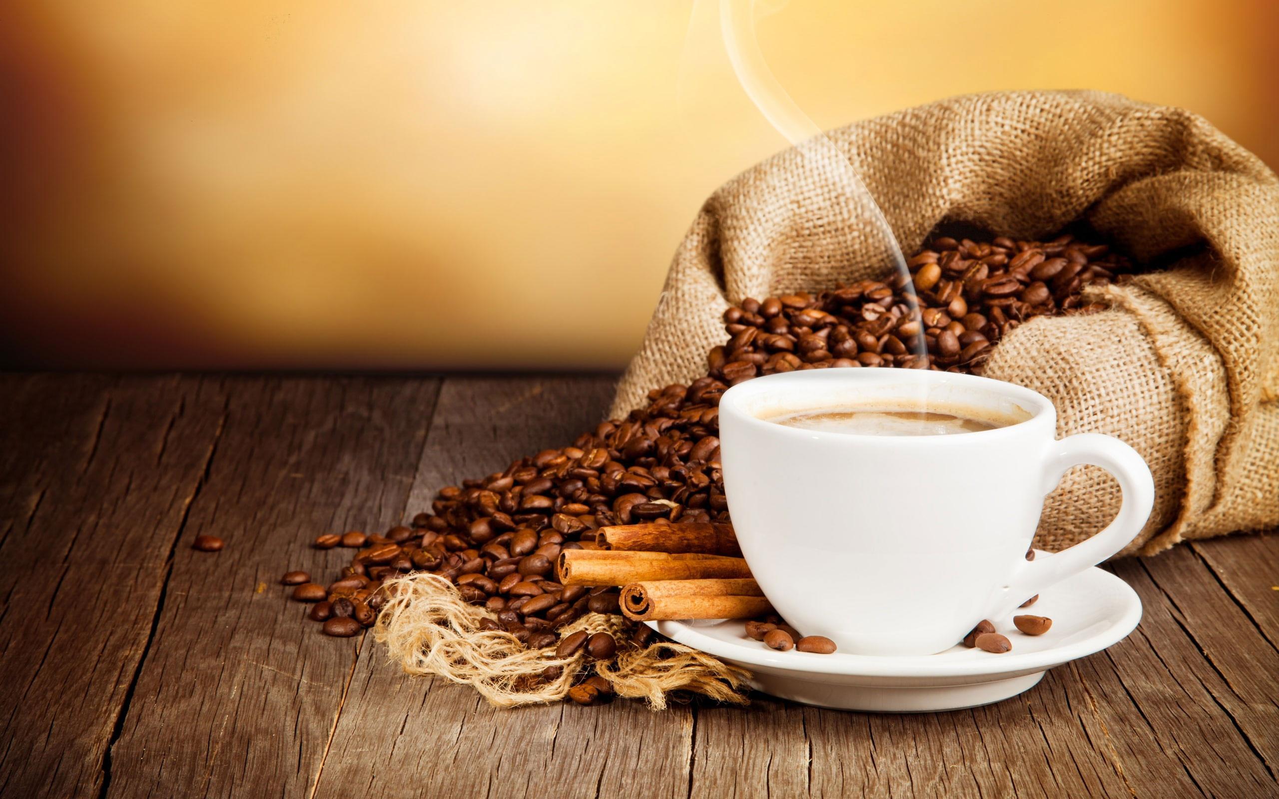 2560x1600 Cup of coffee wallpaper, drink, coffee beans, cinnamon, saucer, white ceramic teacup and saucer beside a sack of coffee beans photo • Wallpaper For You HD Wallpaper For Desktop & Mobile