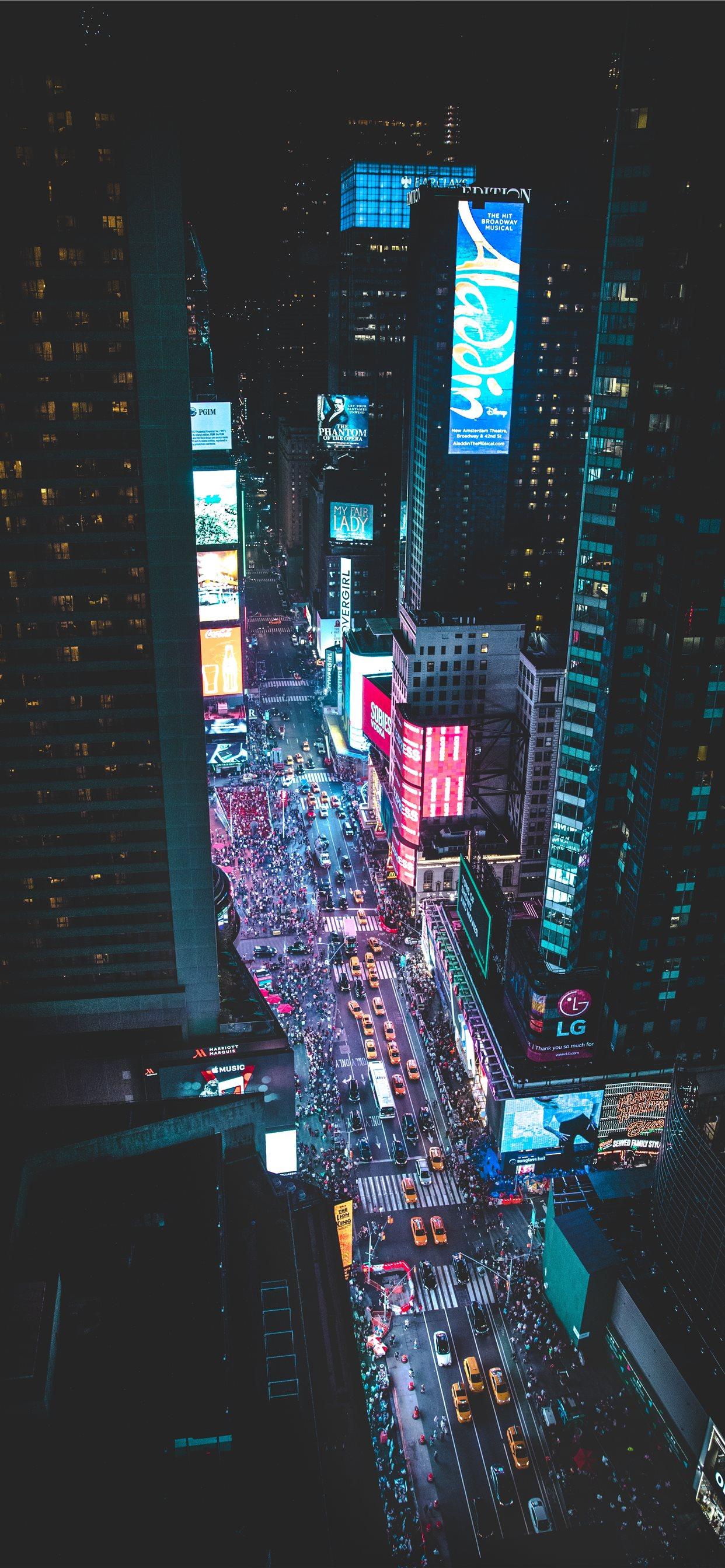 1242x2688 aerial photo of a busy city during night time iPhone 11 Wallpaper Free Download