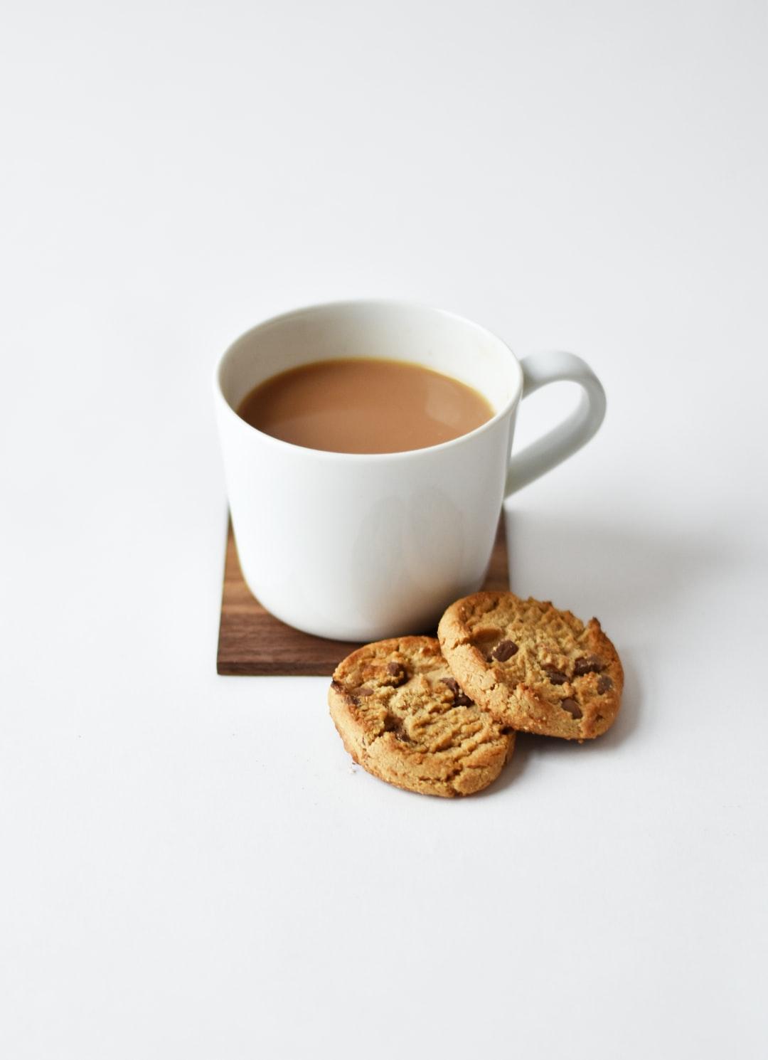 1080x1490 white ceramic coffee mug beside cookies photo