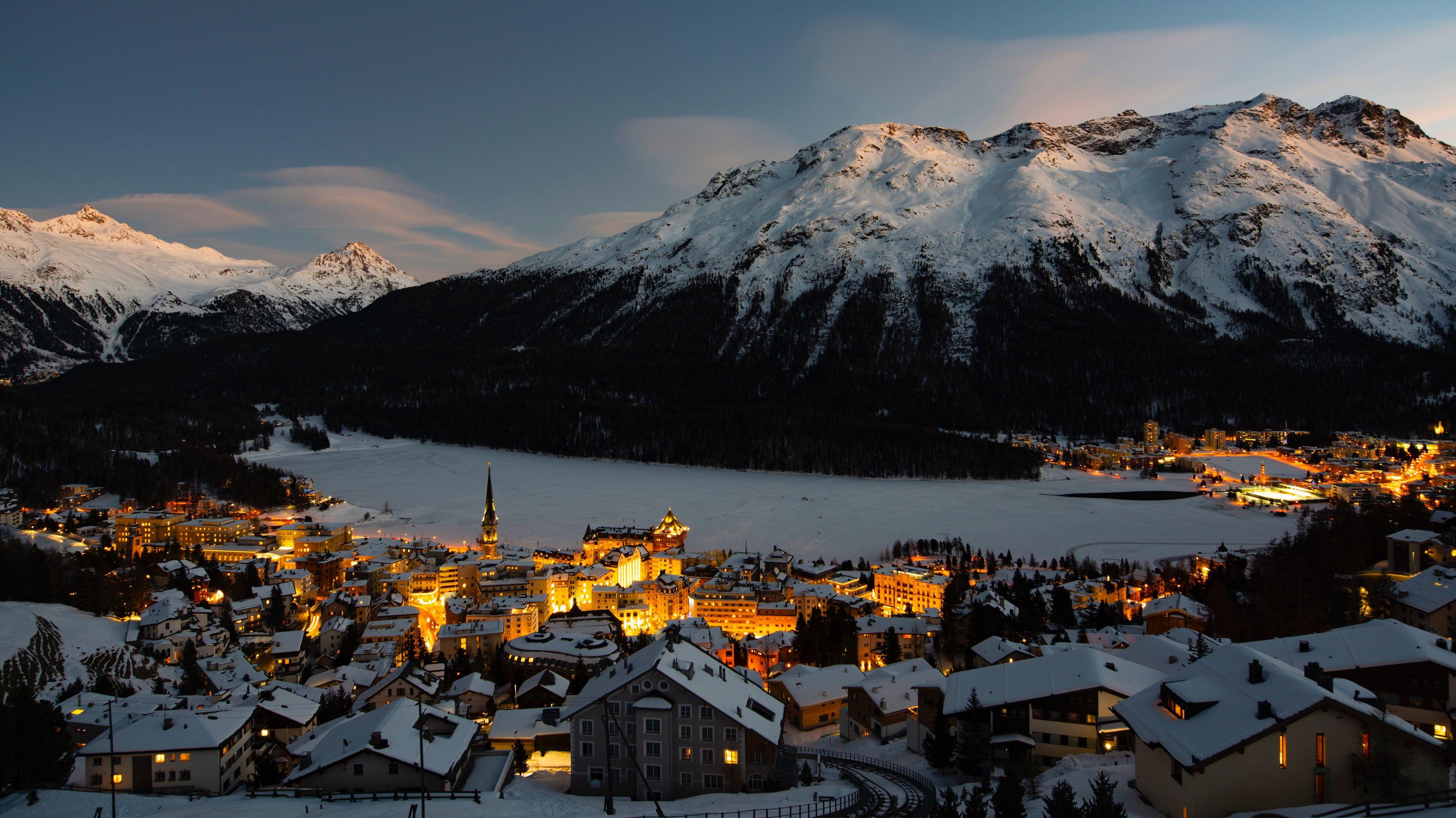 3840x2160 Download wallpaper 3840x2160 mountain, winter, village, snow, light, switzerland 4k uhd 16:9 HD background