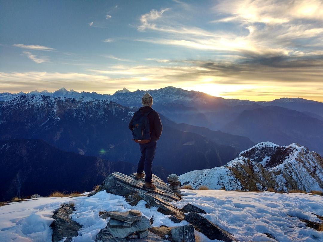 1080x810 person standing on top of the mountain facing sunrise photo