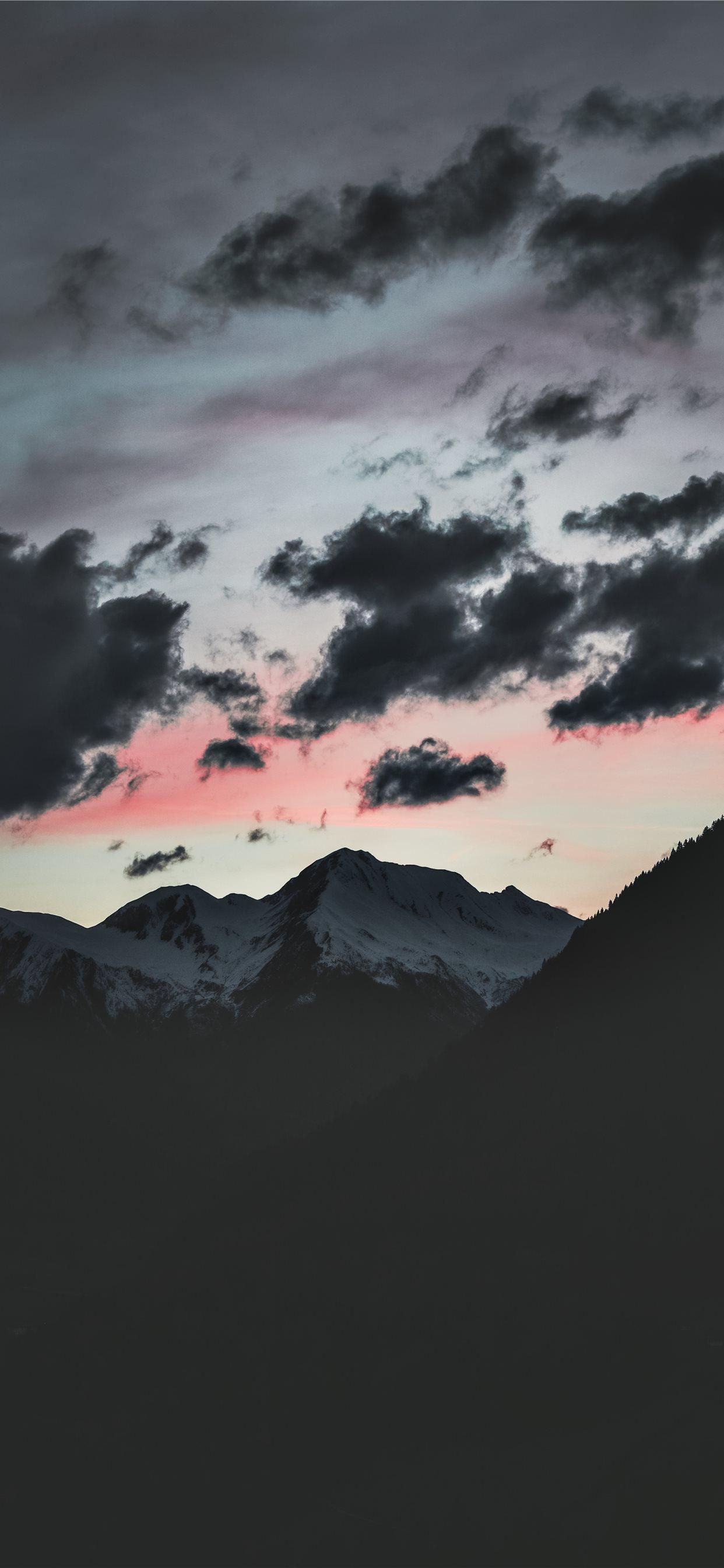 1242x2688 silhouette of mountain under cloudy sky iPhone 11 Wallpaper Free Download