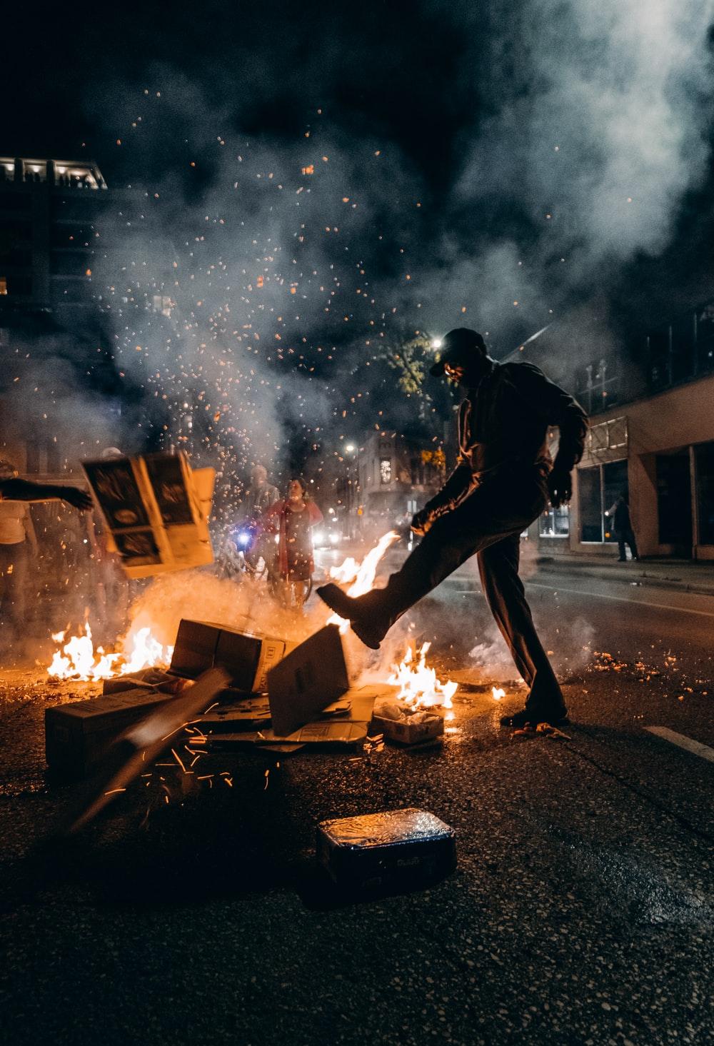 1000x1465 Man In Black T Shirt And Black Pants Holding Fire Photo