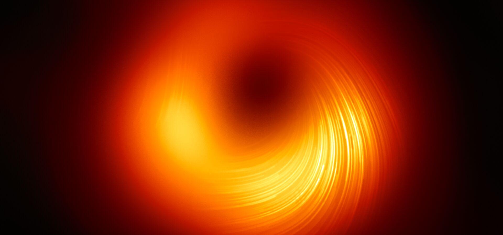 1920x900 Astronomers image magnetic fields at the edge of M87's black hole