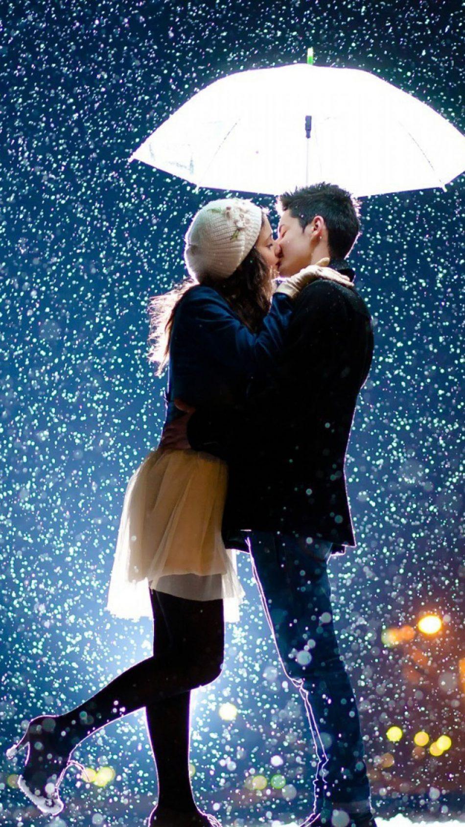950x1689 Couple Kissing Raining Umbrella 4K Ultra HD Mobile Wallpaper