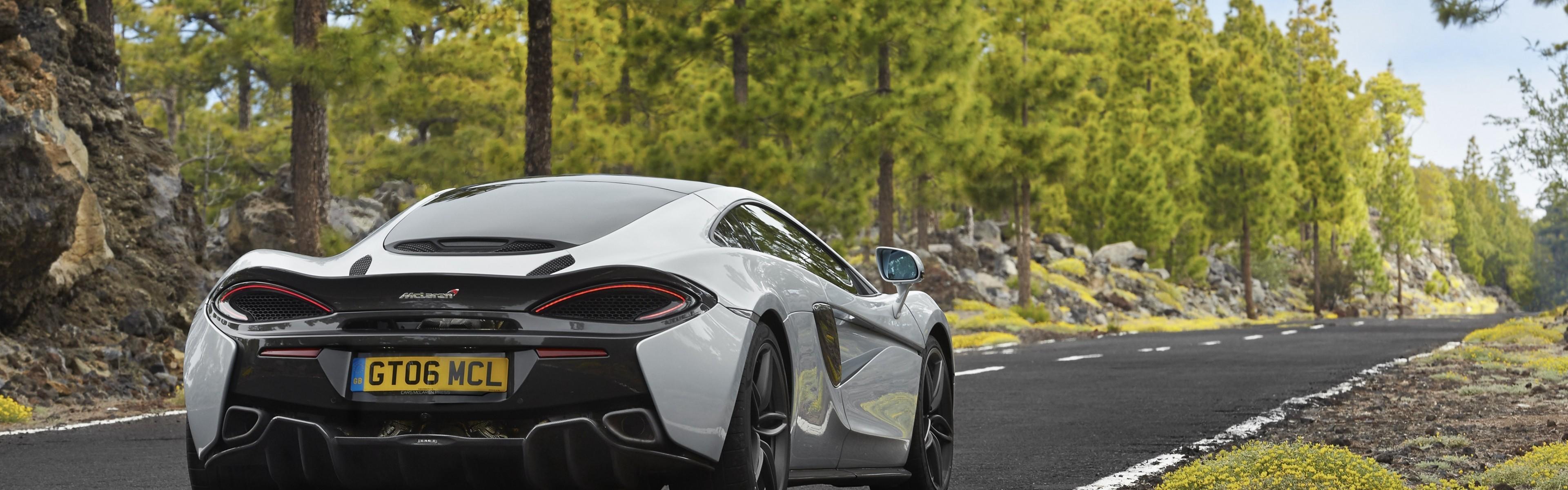 3840x1200 Download 3840x1200 Mclaren 570gt, Back View, Road, Forest, Trees, Gray, Cars Wallpaper
