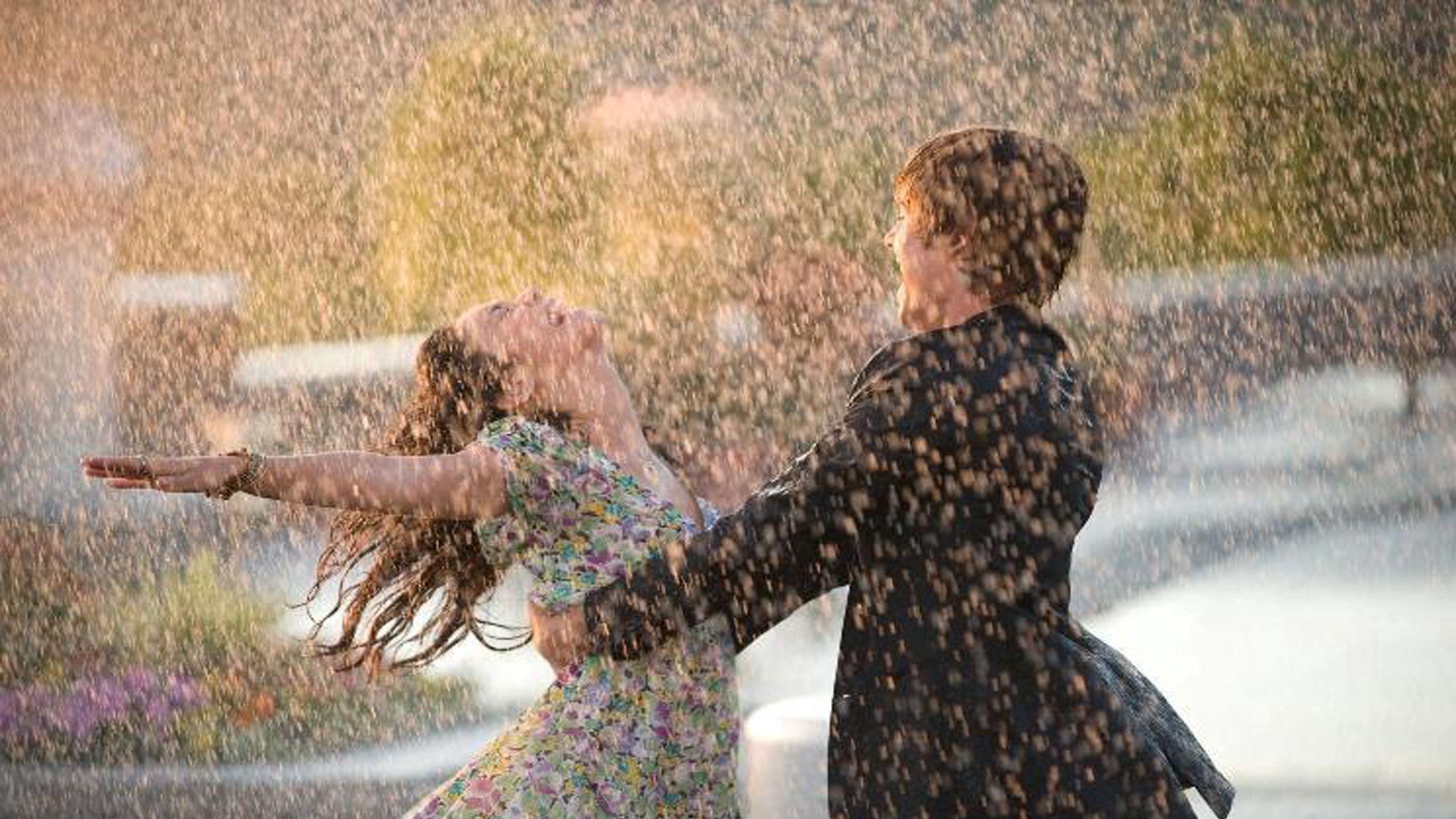 2560x1440 Download wallpaper 2560x1440 couple, dance, happiness, rain, wet, love widescreen 16:9 HD background