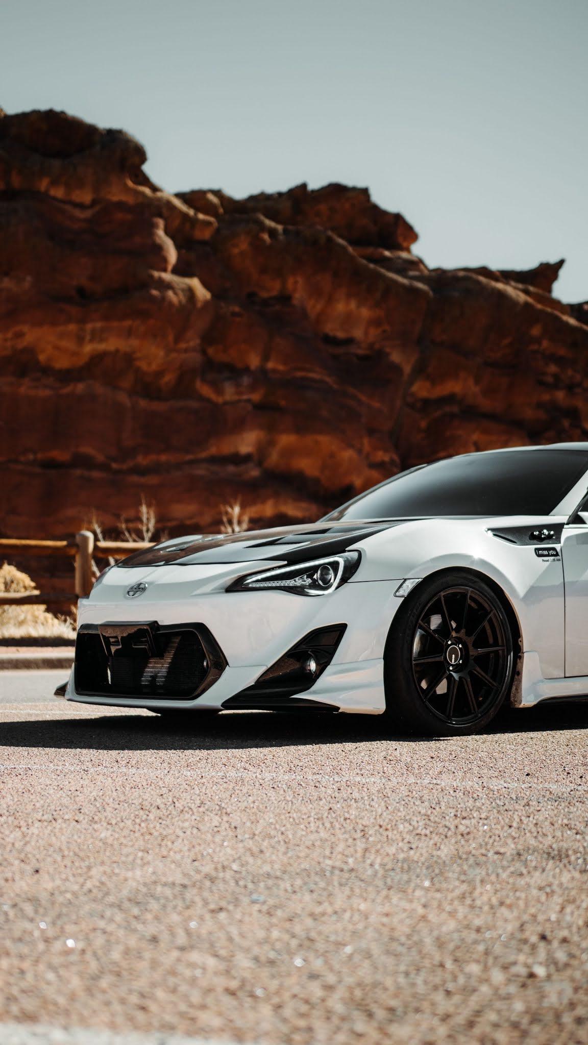1152x2048 Free Toyota GT Black White Car, Road, Rocks Wallpaper