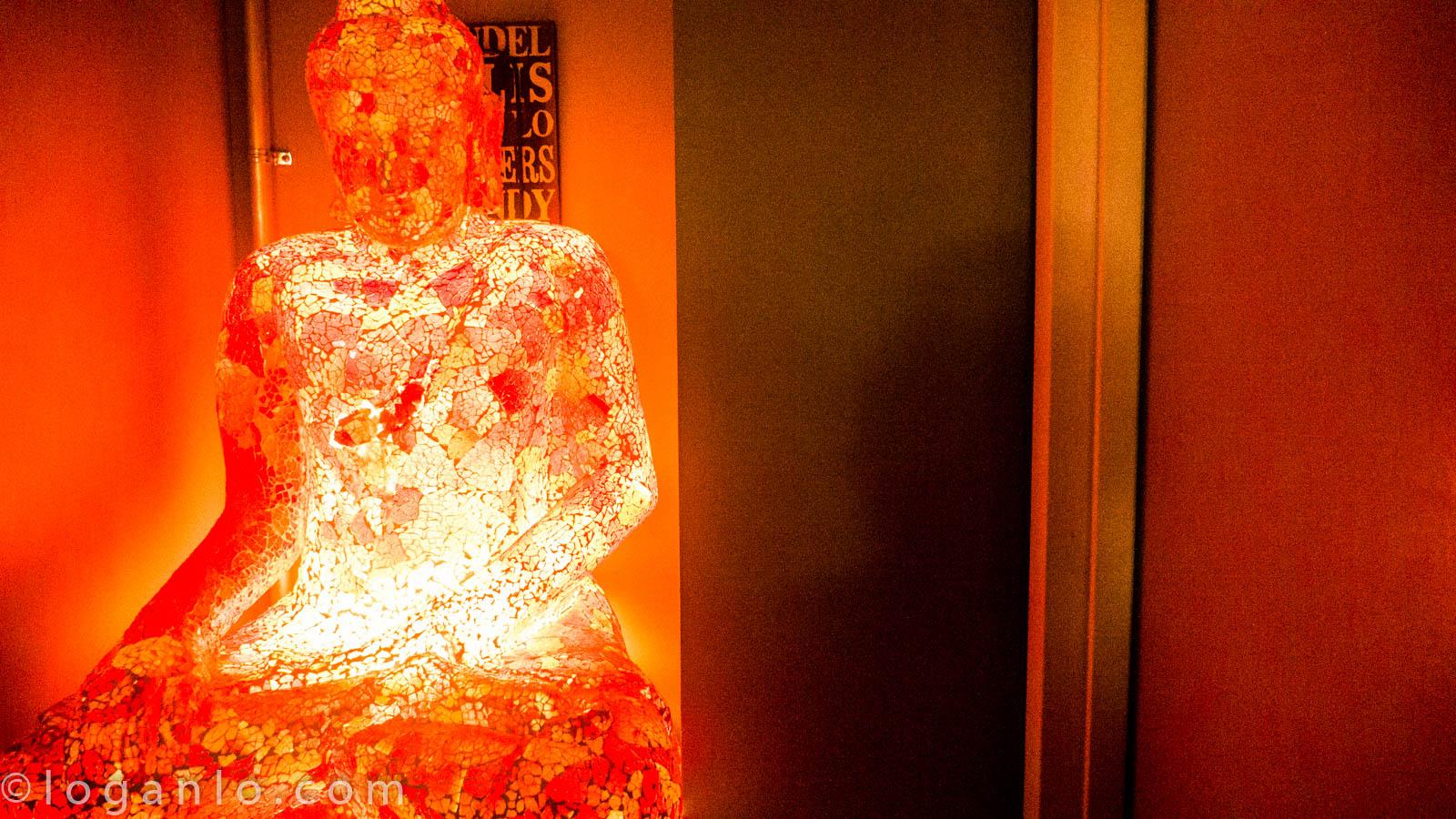 Neon Buddha Statue in a Sea of Serenity