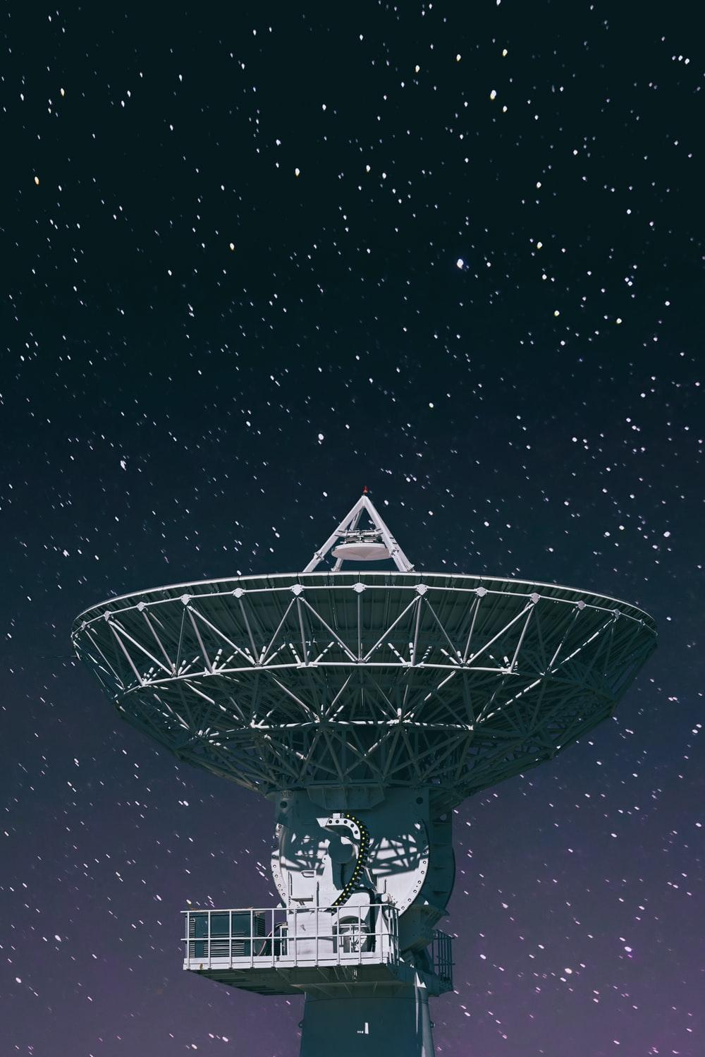 1000x1498 white satellite dish under starry night photo